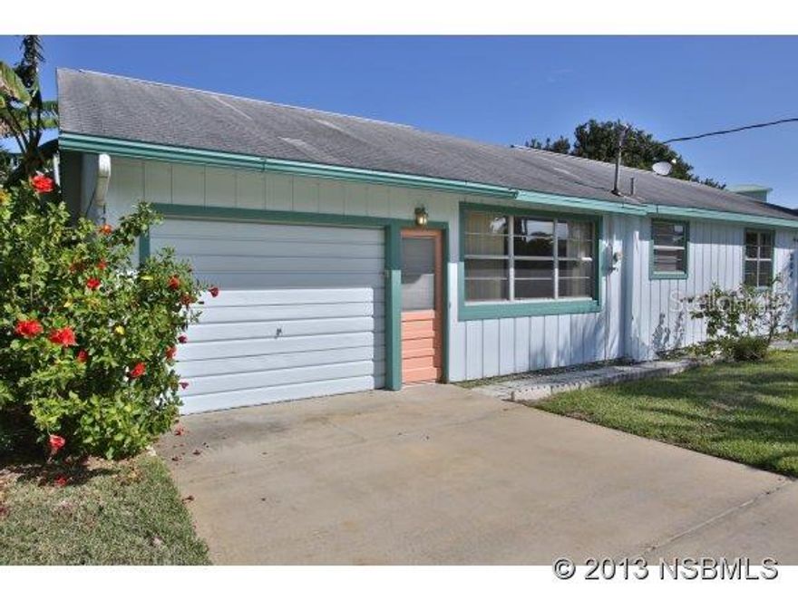 Beach home just a short walk to the beach, and nearby to the playground, tennis,& basketball,& racquetball courts and to the shops and restaurants of Flagler Ave. This home features: hardwood floors and tongue groove wood ceilings hidden by decorative ceiling tiles, washer & gas dryer are in the workshop/garage. Large fenced yard with orange, lemon, grapefruit and banana trees mixed between oak trees. There is a large patio, a fish cleaning station/sink countertop. ;Water: City