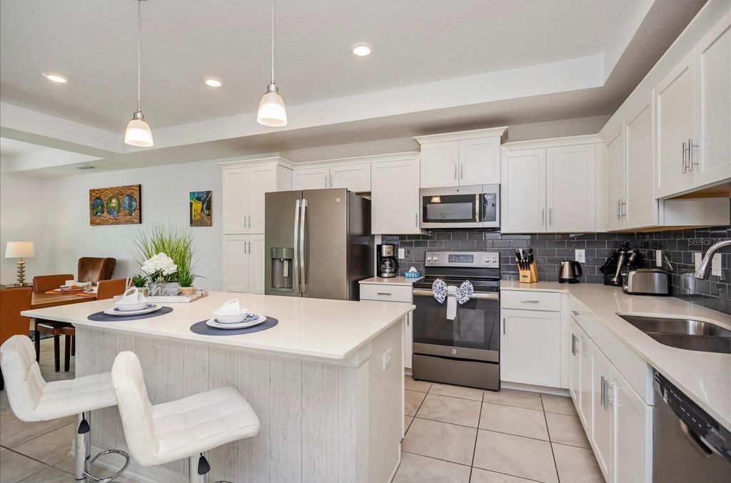 Photo of 4751 Clock Tower Dr #203, Kissimmee, FL 34743 (MLS # G5103991)