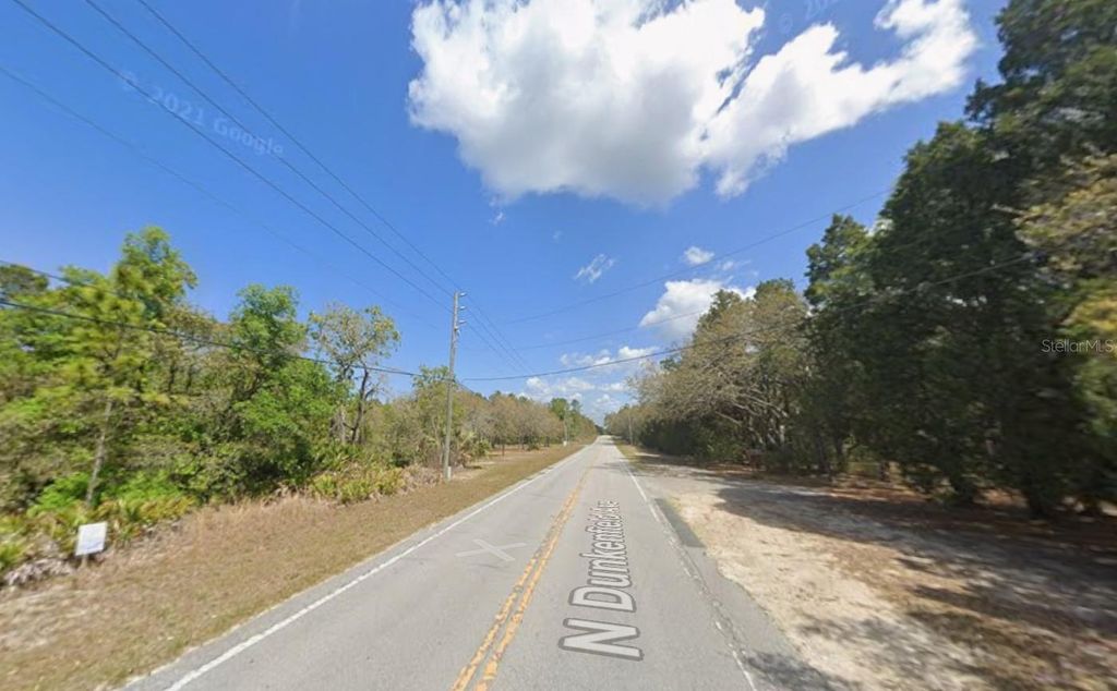 Photo of 632 N Dunkenfield Avenue, Crystal River, FL 34429 (MLS # OK225671)