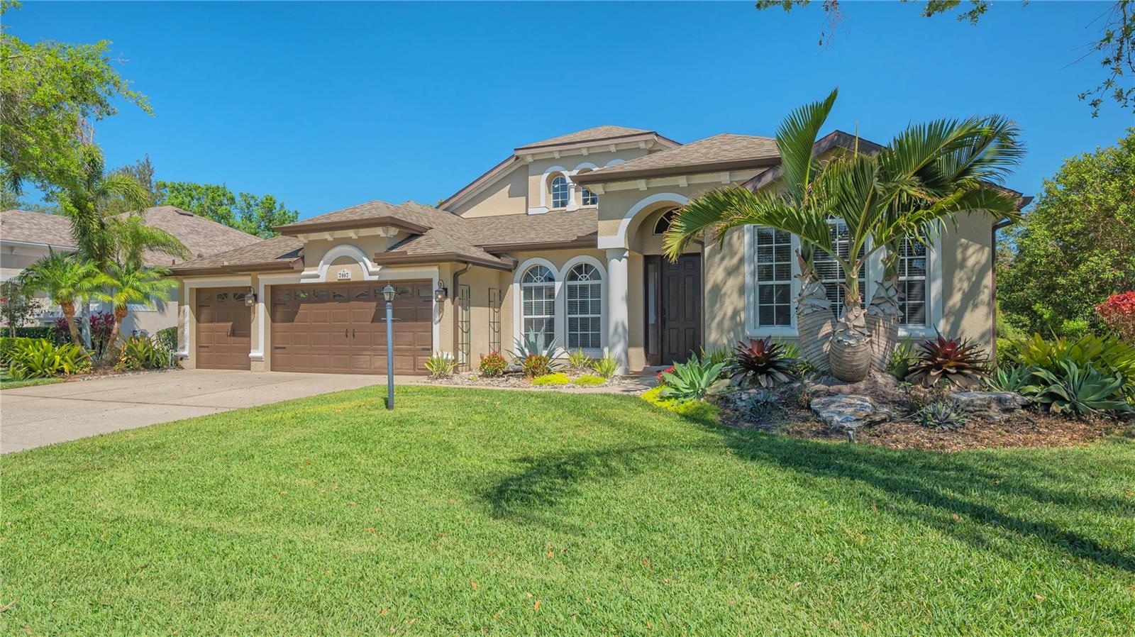 STUNNING UNIVERSITY PARK RESIDENCE! Enjoy 3,114 square feet of open living with gorgeous lake views! This beautiful home features soaring ceilings, a spacious layout, and a perfect blend of elegance and comfort with 4 full bedrooms, 3 bathrooms, a private office and a comfortable family room/den that overlooks the pool. The open-concept design highlights an expansive kitchen with a gas range, bar seating for 4, ample storage, a built-in bar and a breakfast dinette seamlessly flowing into a grand living room and formal dining. The primary suite offers a serene retreat with tranquil water views, sitting area, large ensuite bath, and a generous custom built-out closet. The additional three bedrooms, office and den provide flexibility for work, guests, and/or hobbies. Step outside to a private screened-in lanai, where pool fountains and lush landscaping create a peaceful oasis with no rear neighbors and spectacular sunsets. Located just 2.5 miles from UTC shopping, dining, the highly anticipated new Mote Aquarium, and Benderson Park, this home also offers quick access to Waterside, Lakewood Ranch Town Center, and is less than 9 miles from downtown Sarasota. Situated in the desirable gated community of University Place, residents enjoy resort-style amenities, including two heated pools, a fitness center, nature trails, and playground—all with LOW HOA FEES of $110/month. Recent updates include: ROOF (2020), AC (2023), INTERIOR PAINT (2025), EXTERIOR PAINT, FIREPLACE FEATURE WALL (2020), GARAGE FLOOR (2025), and LANDSCAPING (2023). Don’t miss this rare opportunity to own a spectacular home in an unbeatable location—schedule your private tour today!