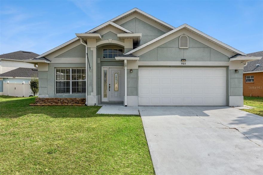 Welcome to 905 Woodsong Way, a beautifully updated 3-bedroom, 2-bath home located in the desirable Woodridge Phase subdivision of Clermont, Florida. This well-maintained home offers 1,638 square feet of living space on a fully fenced lot just over 7,000 square feet, combining comfort, functionality, and investment potential. Recent upgrades provide peace of mind and modern appeal, including a brand-new roof (2024), new water heater (2024), fully paid-off solar panels, new kitchen cabinets with stylish backsplash (2025), fresh interior paint (2025), and a newly enclosed screened patio (2025)—perfect for enjoying Florida living year-round. The fully fenced backyard offers privacy and flexibility for pets or entertaining. No lease restrictions make this property an excellent option for short-term rentals, second homes, or primary residence buyers looking for income potential. Conveniently located near major theme parks, with easy access to Highway 27, I-4, and SR-429, and just minutes from shopping, dining, grocery stores, and medical facilities. This move-in-ready home checks all the boxes for lifestyle, location, and long-term value.