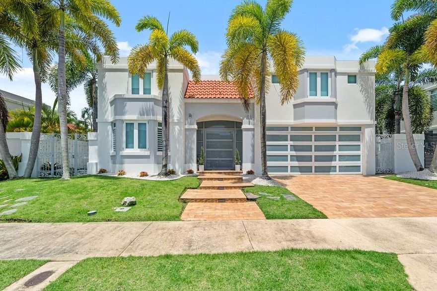 Spacious and move-in-ready, this well-kept two-story home in Paseo Los Corales I offers comfort, functionality, and thoughtful upgrades throughout. The property features 4 bedrooms, 4.5 bathrooms, and a first-floor office, providing ample room for today’s lifestyle needs. A large covered terrace with an air-conditioned salon and wet bar creates the perfect extension of the living space for gatherings or day-to-day enjoyment.

Recent improvements include a renovated kitchen, updated bathroom vanities, a new modern front door and garage door, and a freshly tiled driveway and garage. The home is fully equipped with stainless steel appliances, a 20k power generator, and seven inverter A/C units, offering comfort and efficiency all year long.

Paseo Los Corales I is one of Dorado’s most sought-after gated communities, known for its amenities and convenient location. Residents enjoy tennis, pickleball, and basketball courts, a pool with gazebo, a clubhouse with gym, and double access control for added security.
A solid, upgraded home in a prime Dorado neighborhood, ready for its next owners.