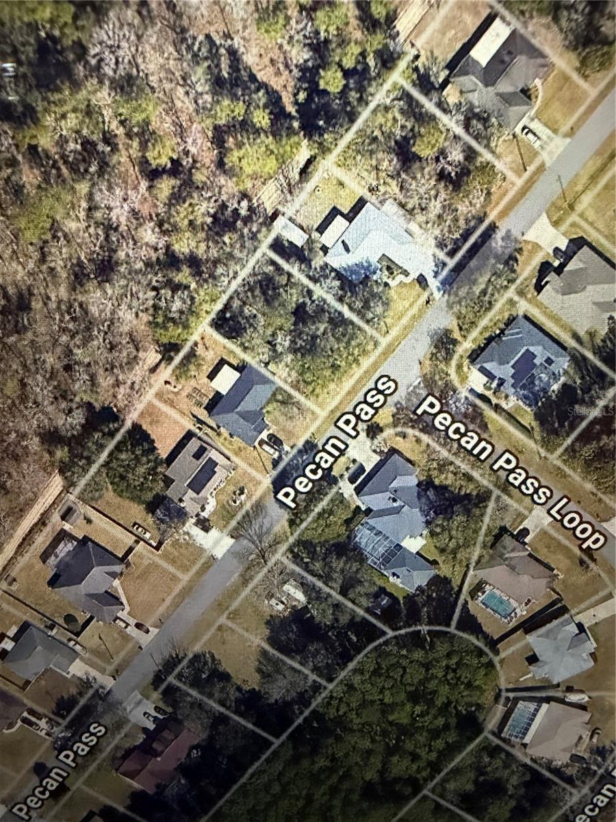 Build Your Dream Home on this nearly 1/4 acre lot with NO REAR NEIGHBORS in Silver Springs, Ocala! Experience the perfect blend of tranquility and convenience on this prime .23-acre lot in the highly desirable SILVER SPRINGS COMMUNITY of Ocala, Florida. Zoned R-1 and ready for your custom build, this spacious lot offers the ideal canvas for your dream home. Enjoy the freedom of NO HOA restrictions, providing privacy and flexibility while being minutes from Downtown Ocala, Gainesville, and The Villages. The property’s unbeatable location near MAJOR HIGHWAYS ensures easy commuting, while nearby shopping, dining, parks, and outdoor recreation add to its appeal. With Ocala’s RAPID GROWTH and the natural beauty of Silver Springs, this is your chance to invest in a thriving community. Don’t miss out—clear the lot and start building the lifestyle you’ve always envisioned today! Property is located in between 91 and 95 Pecan Pass.