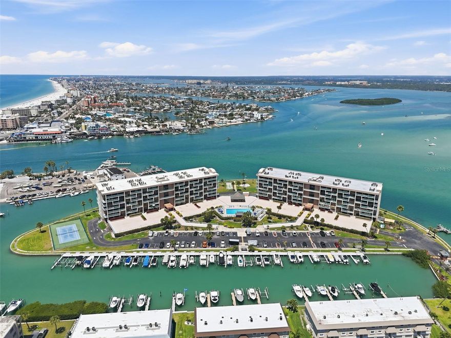 Welcome to your slice of paradise in the gated community of Key Capri on Treasure Island! This beautifully maintained 6th-floor, 2-bedroom, 2-bathroom condo offers the perfect blend of comfort, convenience, and stunning waterfront views. Step inside to a light-filled, inviting interior featuring a spacious open floor plan designed for both everyday living and effortless entertaining. The well-appointed kitchen showcases granite countertops, stainless steel appliances, and ample wood cabinetry - ideal for preparing meals while staying connected to the main living space. The living area flows seamlessly onto your private balcony, where you can unwind with peaceful water views, morning coffee, or breathtaking evening sunsets. The primary suite offers a walk-in closet and an en-suite bathroom with a tiled shower and tub. The second bedroom is equally welcoming, with direct balcony access and convenient proximity to the second bathroom, complete with a walk-in shower. Additional features include a washer and dryer (2019), hurricane-impact windows and doors (2017), and an assigned garage parking space located just steps from the elevator for added ease. Key Capri residents enjoy an impressive array of amenities, including a waterfront marina (first-come, first-served), fishing pier with cleaning station, heated pool and spa, tiki bar, outdoor grills, tennis courts, fitness center, sauna, and kayak launch - all within a secure, gated community. Ideally located just minutes from local dining, shopping, and the beautiful Gulf beaches, this condo offers the ultimate Florida lifestyle - peaceful waterfront living with everything you need close by. Don’t miss the opportunity to make this exceptional property your own!
