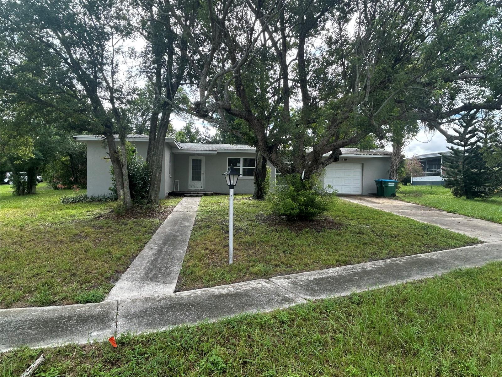 Handyman home but has great potential. This home had a new roof installed in 2019. The service panel has been upgraded and some of the plumbing has been upgraded. The windows appear to be newer. The bonus room could easily be converted to a 2nd bedroom. The garage has a workshop on the side. Nice big shed in the backyard. This home sits on a corner lot with sidewalks. Great potential here. Check it out.
