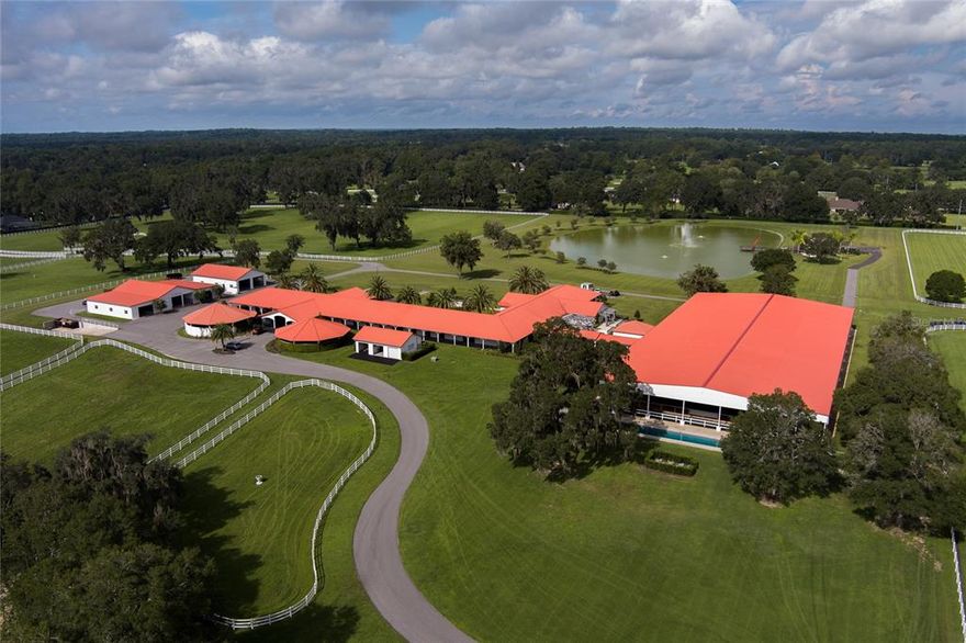 Making its debut on the market is Besilu South!  This 153+/- acre farm is nothing short of a five-star equestrian resort!  No stone was left unturned by its present owner when it came to transforming  this farm into a thing of function, accessibility, comfort, and beauty.  Enter the paved, double gated, tree lined entrance to the land of enhancement.  The training facility can be your first stop; 39 stalls fill the space, together with every amenity you would expect, including laundry, bathroom, kitchen, fans, fly spray, auto water, and washracks.  There is a covered programmable Eurosizer, a separate building housing the Hyrda horsepool, an exercise pool, and a oversized covered arena with theater-style seating in the viewing area, fans, LED lights, surround sound, and an ultra high-tech dynamic camera system, so that training sessions and workouts can be observed remotely from afar.  There is a covered patio adjacent to the arena for additional gathering and seating.  Attached to the stables via portico is a meeting/events center with a full chef's kitchen and meeting room, as well as three 1 BR/1BA VIP guest apartments.  Move on across to the West to the outdoor living pavilion overlooking the pond for fun, relaxation, and outdoor events. The office has multiple office/meeting rooms, including conference room, front reception, kitchen, dining, laundry, lodging, and tons of windows for all the great views beyond.  The "Filly" house has a screened pool and has been renovated into four apartments, one is a 2 BR/2BA with full kitchen, and three are 1 BR/1BA with kitchenettes. The main house is located via its own private gate to the Country Club. It has high ceilings, 3 fireplaces, pool and outdoor seating, and a bonus bedroom and full bath upstairs via spiral staircase.  The office, home and other accommodations all have "smart" technology, including lights, window shades, and more.  The entire farm has been enhanced with outdoor lighting which is evident by the photos.  This farm is so much more than words can describe, but rest assured, it will leave you speechless.  Details of renovations, smart technology, and more will be provided as an attachment.