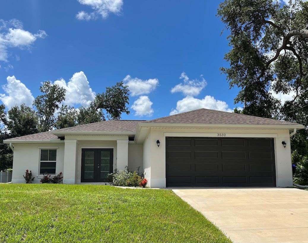 Add this beautifully crafted home to your must-see list! Located in a prime area of North Port, this modern residence was built in 2023 by Kanopy Homes and features the sought-after Banyan floor plan. With 1,552 sq ft of living space, it offers 4 spacious bedrooms and 2 bathrooms in a thoughtfully designed split-bedroom layout. Enjoy stylish upgrades throughout, including luxury vinyl plank flooring, sleek quartz countertops, stainless steel appliances, and shaker-style cabinetry. The double-door entry adds a grand touch, while the open layout makes the home feel light and inviting. No HOA, no CDD, and not located in a flood zone — giving you peace of mind and freedom. Conveniently close to shopping, dining, and daily amenities. This home combines modern finishes with an unbeatable location — schedule your showing today!