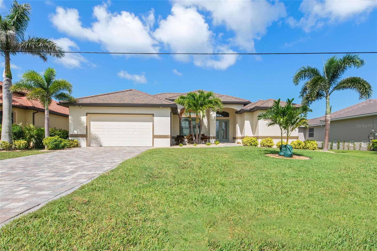 Located in the desirable riverfront community of Burnt Store Lakes, this custom, quality-built waterfront pool home is designed for a life well-lived. Positioned on a premium lakefront lot with a 20+ acre conservation area directly across the street, it provides exceptional privacy and a serene setting you’ll appreciate every day. The three-bedroom, two-bath + den great room plan was thoughtfully designed to showcase panoramic 400 ft long lake views from most rooms.
Zero-corner sliders in the great room erase the boundaries between inside and out, creating a natural flow for entertaining or quiet enjoyment. Plantation shutters, crown molding, rich hardwood, and staggered tile flooring, along with a soothing color palette, make the interiors as inviting as the outdoors.
Entertaining is effortless in the beautifully appointed kitchen, featuring 42-inch soft-close cabinetry, gleaming quartz countertops, and a stylish glass tile backsplash. The space is thoughtfully designed with bar seating, a spacious closet pantry, under-cabinet lighting, and a dedicated coffee bar that adds a touch of luxury to your daily routine.
The formal dining space offers stunning pool and lake views. Experience the ultimate in casual dining by stepping outside to our inviting poolside summer kitchen and outdoor dining areas—perfect for relaxed meals and unforgettable moments.
Relax and unwind in this stunning owner's suite with French doors opening onto the spacious lanai. Indulge in the spa-inspired bath with a luxurious rain shower, and enjoy every detail designed for comfort and style. Keep your life perfectly organized with double California closets, while the double vanities and linen closet add extra functionality.
The den/office features a large window with a transom top, filling the room with gentle natural light and crafting a warm, inviting atmosphere. Guest bedrooms are spacious and come with generous closets, ensuring comfort and convenience for everyone.
This home has been impeccably maintained and every detail thoughtfully planned — from WiFi-enabled security, climate control, and irrigation systems to the epoxy-finished garage with overhead storage and generator hook-up. All exterior doors and windows are equipped with impact-resistant storm protection. The driveway, sidewalk, porch, lanai, and pool deck are finished with attractive stone pavers. Low-maintenance rock beds, framed by concrete curbing and supported by an irrigation system, keep the landscaping looking neat year-round.
This prime location in Punta Gorda’s Burnt Store Corridor transforms everyday living into a tropical getaway. Resort amenities at nearby Burnt Store Marina offer gulf access and marine rentals, dining, executive golf, tennis, pickleball, and a variety of other activities just minutes away.
Burnt Store Lakes is about 30 minutes from Punta Gorda Airport and a one-hour drive from Fort Myers Airport.