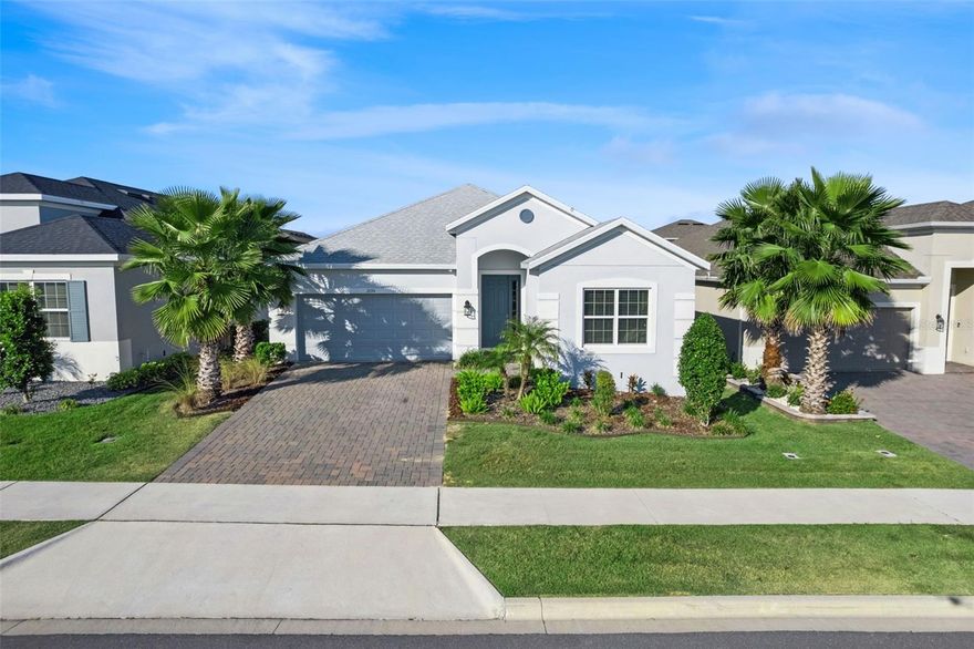 Welcome to this beautifully maintained, modern home in the sought after Canyons at Highland Ranch community in the heart of Minneola! Thoughtfully upgraded, this residence offers stylish finishes, functional spaces, contemporary finishes, and the perfect layout for everyday living and entertaining. Step inside to an inviting open-concept design highlighted by glass sliders that fully open, creating a seamless indoor–outdoor flow and filling the home with natural light. The modern kitchen is a true standout at the heart of the home, featuring a gas stove, Butler's pantry and separate large walk-in pantry, and spacious island overlooking the dining and living areas - a chef's dream with plenty of space for prep, storage and excellent organization. The main living spaces flow effortlessly, offering comfort, functionality, and beautiful natural light. The home’s modern touches continue throughout, showcasing updated fixtures, fresh appeal, and meticulous care at every turn. Bedrooms are generously sized and the primary suite includes a well-appointed bathroom and walk-in closet. The Canyons at Highland Ranch boasts amenities including scenic walking areas, community pool, park and playground. This home offers quick access to plenty of shopping and dining options, Minneola Athletic Complex, and Lake Minneola waterfront park and is minutes from Florida's Turnpike for an easy commute to Orlando, Winter Garden and the theme parks. With its clean aesthetic, smart layout, and beautifully connected living spaces, this home is truly move-in ready and a must-see!