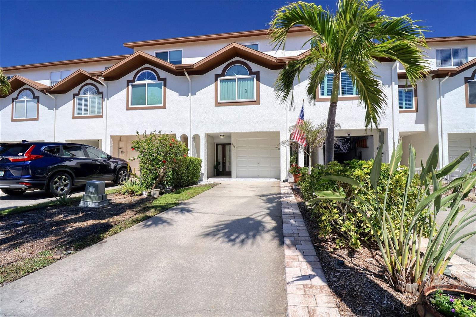 TENNIS ANYONE? Or pickle ball. If you want this lifestyle, to play tennis and have pets, up to two 100 lb dogs, this three bedroom and three bath townhome may be the one. From the balcony the view is of the tennis and pickle ball courts that have been recently refreshed. There are hurricane shutters and newer sliders.
This well maintained townhome shows the care that has been taken. The community is active and you can fish from the community pier. Nearby beaches and restaurants. Wood burning fireplace and skylights. There is tandem garage parking. Storage closet downstairs in garage. In the garage go out the back door to the patio and that leads directly to the courts.
The kitchen has stone counters and matching appliances.