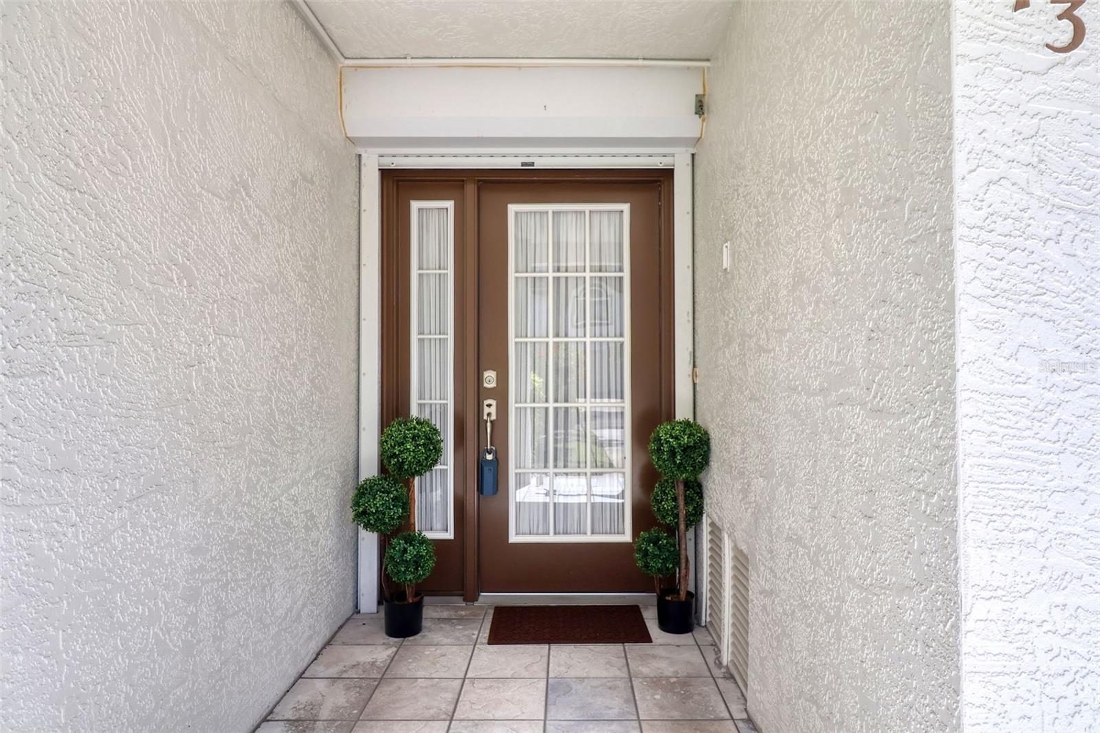 TENNIS ANYONE? Or pickle ball. If you want this lifestyle, to play tennis and have pets, up to two 100 lb dogs, this three bedroom and three bath townhome may be the one. From the balcony the view is of the tennis and pickle ball courts that have been recently refreshed. There are hurricane shutters and newer sliders.
This well maintained townhome shows the care that has been taken. The community is active and you can fish from the community pier. Nearby beaches and restaurants. Wood burning fireplace and skylights. Jacuzzi whirlpool tub in hall bath. There is tandem garage parking. Storage closet downstairs in garage. In the garage go out the back door to the patio and that leads directly to the courts.
The kitchen has stone counters and matching appliances.