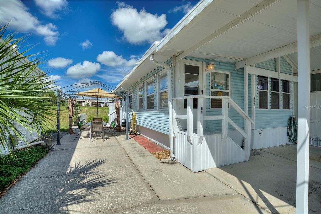 Photo of 305 Arnold Palmer Drive, Davenport, FL 33837 (MLS # O6345107)