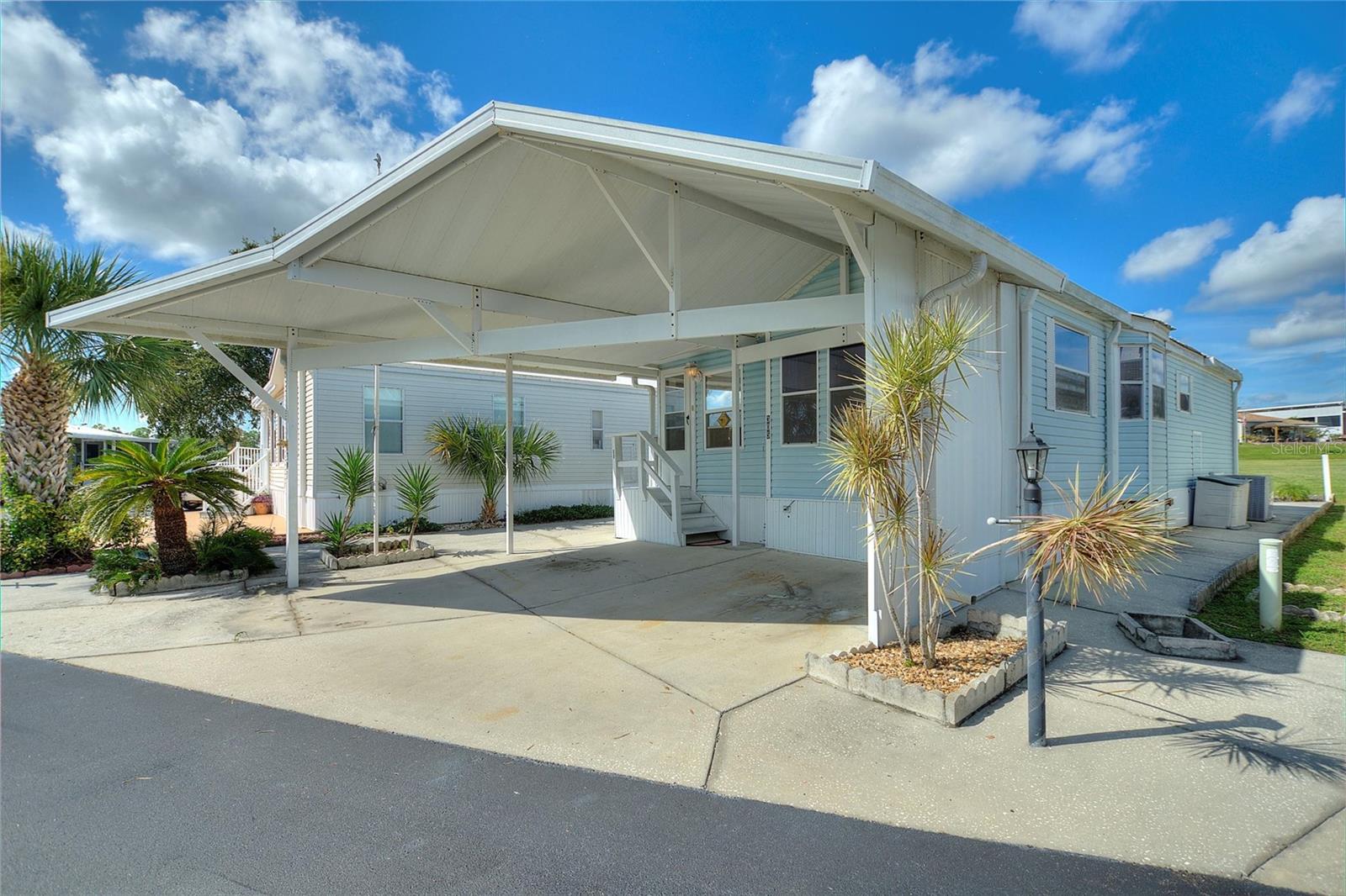 Welcome to DEER CREEK RV GOLF & COUNTRY CLUB! It’s the perfect time to purchase your new FLORIDA GETAWAY! Whether you are looking for a sunny place to winter or a full-time residency, this two-bedroom, two bath turn key model is perfect! Located on the 6th fairway of the fabulous Deer Creek Golf Course! This getaway features an open concept living, dining & kitchen area plus a spacious & airy Florida Room that's great for guests! New AC, freshly painted & well maintained! The backyard is the perfect spot for entertaining with family & friends or relaxing under the gazebo! This lot has plenty of covered parking for your vehicles & golf carts! The shed is attached with plenty of storage for your golf clubs & pool toys! Great location just minutes from the Eagles View Community Clubhouse, Pool & Shuffleboard Courts! If you love RESORT style living, this is the place for you! Deer Creek Community also has a MAIN CLUBHOUSE offering a variety of social events throughout the year such as Karaoke, Trivia, Cardio Drumming, Line Dancing, Crafts, Swing Dancing & more! Soak up the sun at Deer Creek’s MAIN pool, cabana & hot tub area! Try water volleyball, pickleball, tennis, shuffleboard or pool aerobics! Love golfing? Check out Deer Creek’s 18 Hole Executive Golf Course Leagues & shopping at Pro Shop! The Tiki Bar is a great place to meet new friends with occasional live bands & music! The Greenside Grill is perfect for onsite dining! Deer Creek is centrally located in Davenport just 20 minutes from Disney & all the attractions that families enjoy! Hop on your golf cart & ride to many restaurants & shops nearby. Bealls, Marshalls, Target & Star Bucks are in Posner Park less than a mile away! Call today to view this HIDDEN GEM in sunny Florida! Just 1.5 hours to each COAST! Looking for a slice of paradise? Let us show you Deer Creek today!