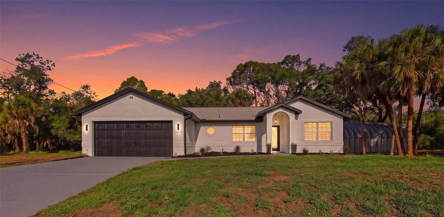 Almost three-quarters of an acre, a fully finished detached hangar, a complete designer remodel, and not in a flood zone. Welcome to 3813 Crittendon St, the rare North Port property that delivers space, quality, and serious flexibility all in one shot, at a price that won't last.
THE LAND: Forget the tight quarter-acre lots found everywhere else in North Port. This home sprawls across .69 private, palm-dotted acres with room for a pool, RV and boat parking, a garden, or a guest suite, with privacy on every side.
THE HANGAR: This is the one you've been searching for. A massive, fully enclosed metal hangar with epoxy floors, overhead lighting, electric, a roll-up door, and a separate side entry. Store the RV, the boat, and the project cars. Run a business. Build the ultimate workshop, home gym, or man cave. There is nothing like it at this price, and it is all in addition to the home's attached 2-car garage.
THE REMODEL: Step inside to soaring vaulted ceilings, wood-look tile flowing throughout, and light pouring in from every direction. The kitchen steals the show with crisp white shaker cabinetry, quartz countertops, a marble-style backsplash, stainless steel appliances, a huge island with seating, a built-in wine fridge, and a sunny bay-window dinette. Both baths are fully reimagined with quartz vanities, designer tile, frameless glass showers, and backlit LED mirrors for a true spa feel. Add a bright sunroom, plantation shutters, recessed lighting, and indoor laundry. The home offers 1,264 sq ft of living space and 1,464 under roof.
MOVE-IN READY: A brand-new AC, a 2019 roof, and an X flood zone with no flood insurance required mean the big-ticket items are already done.
All of it just minutes from North Port shopping, dining, top-rated schools, and I-75 to Sarasota, Venice, and the Gulf beaches. A full remodel, nearly three-quarters of an acre, and a hangar, all under $350,000. Homes like this don't sit. Schedule your private showing today!