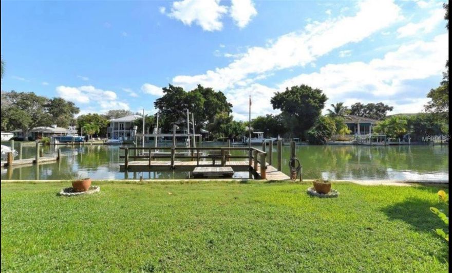 The home is located on the north end of Siesta Key, no bridges to the Sarasota Bay on Hansen Bayou.  Perfect for your sailboat -- no bridges to the Sarasota Bay going south.  Plenty of room for a large bat.  With more than a half acre of land, this property allows extremely private.  Beautiful house ready to move or perfect lot to build your dream house.