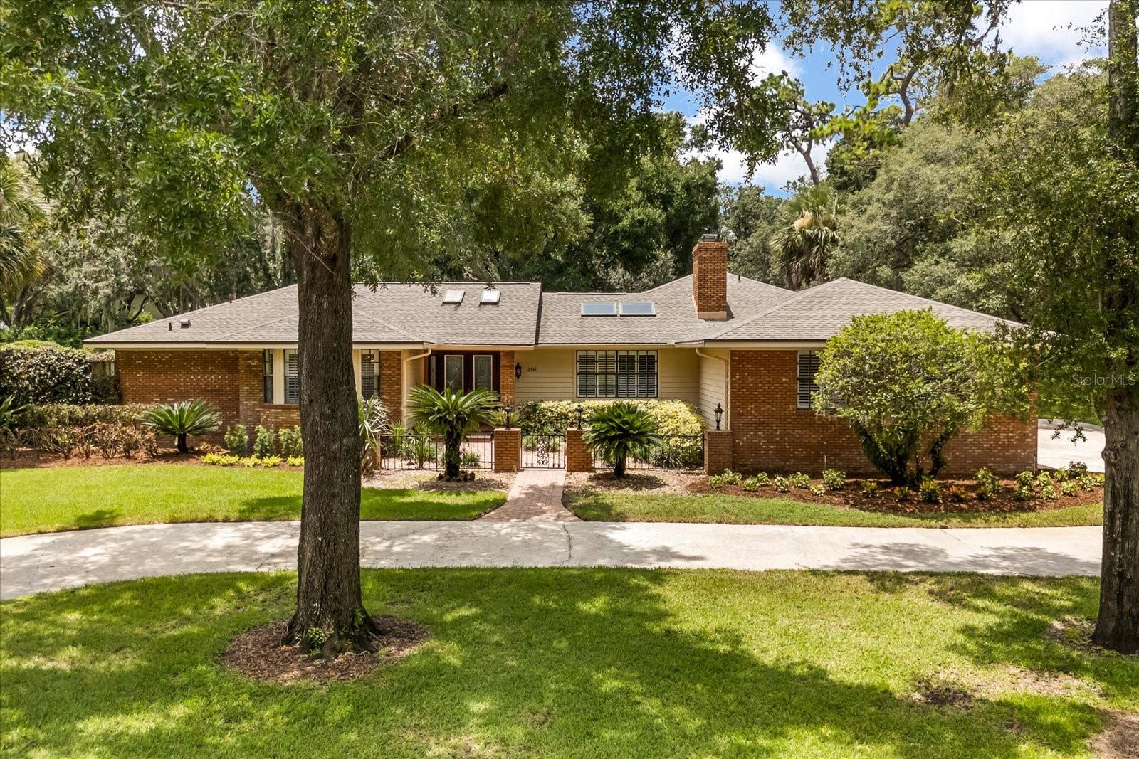 Amazing multigenerational home in the highly desired community of Sweetwater Cove! It's rare to find such an exceptional traditional home with a beautiful attached guest apartment! The main house is a spacious 4/3 with a functional split floor plan including formal living and dining areas and a large Florida room overlooking the pool area. The guest apartment is a 1/1 with it's own screened porch and private entrance. The majestic oaks and manicured landscaping on an elevated lot offer curb appeal galore! Entering into the foyer, you'll appreciate all the details that give this home character, including the gorgeous iron and glass front doors, beautiful wood flooring, cedar ceilings, light flooding skylights, built in bar area, framed windows and more! Off the foyer, you'll find a generous living room with bay windows and a handsome dining room with distinctive framed walls. The primary suite has a large walk-in closet, overlooks the amazing pool area and has it's own private courtyard/garden area off the bath!
The kitchen also looks out to the pool and features an eat-in area, wood cabinetry, a new GE stove, newer Cafe refrigerator & Bosch dishwasher.
You will love the comfortable, picture-perfect Family room! An impressive wood burning fireplace surrounded by brick flows over to the built-in bar. Above, you'll find vaulted tongue and groove cedar ceilings and light and bright skylights. The secondary bedrooms have a private hallway with a pocket door that affords your guests privacy. Two of the secondary bedrooms have large walk-in closets (another has a large built-out closet) There is also a very large "Costco Closet" off the hallway for all of your larger items. Off the back, there is a generously-sized Florida room overlooking the pool with an attractive built-in brick grill area. The newly built-out guest apartment features it's own sidewalk leading to a private screened porch. You can also access the apartment off the lanai through a french door. This wonderful apartment was completed in '22 and features a stylish modern kitchen, family room, bath and bedroom with a large walk-in closet! You'll want to spend all of your time in the amazing private pool & spa area which is surrounded by beautiful pavers and looks out to a lush line of trees and plants. Beyond the lanai is a built-in fire pit area for those cooler nights! Other updates/features include newer roof and family room skylights ('21), 3.5 ton high efficiency HVAC ('22), lanai screens ('22), pool heater ('20), blown-in insulation (’22) and a paid-off 17.6KW solar system ('22) which offers a 3k reduction in your yearly energy costs! The huge garage has very large built-in shelving for oodles of storage! Sweetwater Cove is a wonderful community with access to a plethora of amenities including multiple tennis courts, playgrounds, sports fields, fishing docks, pavilions & a private Lake Brantley boat ramp. Situated just minutes from Wekiva State Park and a multitude of dining & shopping! Zoned for A-rated schools! You will absolutely LOVE living here!