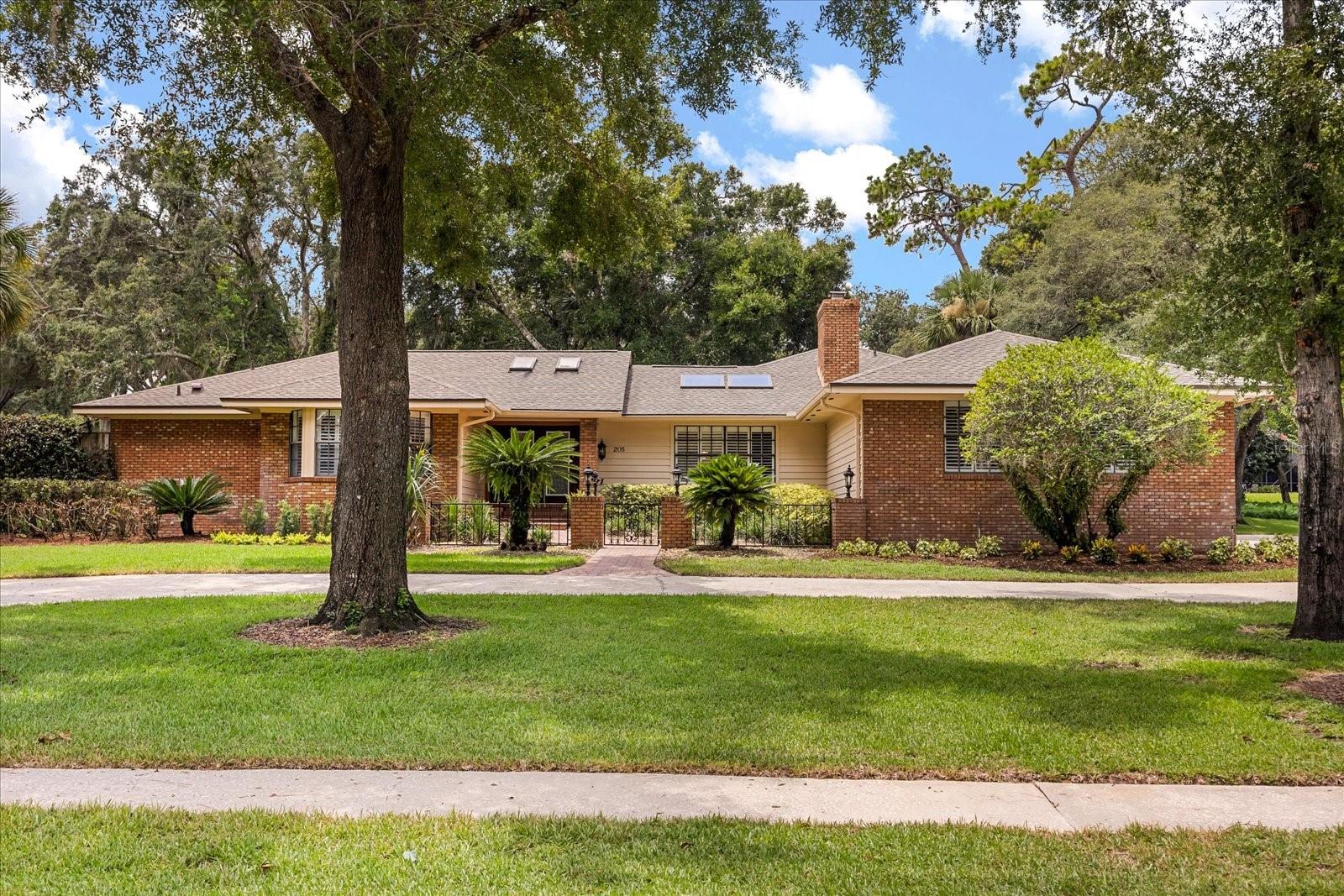 Amazing multigenerational home in the highly desired community of Sweetwater Cove! It's rare to find such an exceptional traditional home with a beautiful attached guest apartment! The main house is a spacious 4/3 with a functional split floor plan including formal living and dining areas and a large Florida room overlooking the pool area. The guest apartment is a 1/1 with it's own screened porch and private entrance. The majestic oaks and manicured landscaping on an elevated lot offer curb appeal galore! Entering into the foyer, you'll appreciate all the details that give this home character, including the gorgeous iron and glass front doors, beautiful wood flooring, cedar ceilings, light flooding skylights, built in bar area, framed windows and more! Off the foyer, you'll find a generous living room with bay windows and a handsome dining room with distinctive framed walls. The primary suite has a large walk-in closet, overlooks the amazing pool area and has it's own private courtyard/garden area off the bath!
The kitchen also looks out to the pool and features an eat-in area, wood cabinetry, a new GE stove, newer Cafe refrigerator & Bosch dishwasher.
You will love the comfortable, picture-perfect Family room! An impressive wood burning fireplace surrounded by brick flows over to the built-in bar. Above, you'll find vaulted tongue and groove cedar ceilings and light and bright skylights. The secondary bedrooms have a private hallway with a pocket door that affords your guests privacy. Two of the secondary bedrooms have large walk-in closets (another has a large built-out closet) There is also a very large "Costco Closet" off the hallway for all of your larger items. Off the back, there is a generously-sized Florida room overlooking the pool with an attractive built-in brick grill area. The newly built-out guest apartment features it's own sidewalk leading to a private screened porch. You can also access the apartment off the lanai through a french door. This wonderful apartment was completed in '22 and features a stylish modern kitchen, family room, bath and bedroom with a large walk-in closet! You'll want to spend all of your time in the amazing private pool & spa area which is surrounded by beautiful pavers and looks out to a lush line of trees and plants. Beyond the lanai is a built-in fire pit area for those cooler nights! Other updates/features include newer roof and family room skylights ('21), 3.5 ton high efficiency HVAC ('22), lanai screens ('22), pool heater ('20), blown-in insulation (’22) and a paid-off 17.6KW solar system ('22) which offers a 3k reduction in your yearly energy costs! The huge garage has very large built-in shelving for oodles of storage! Sweetwater Cove is a wonderful community with access to a plethora of amenities including multiple tennis courts, playgrounds, sports fields, fishing docks, pavilions & a private Lake Brantley boat ramp. Situated just minutes from Wekiva State Park and a multitude of dining & shopping! Zoned for A-rated schools! You will absolutely LOVE living here!