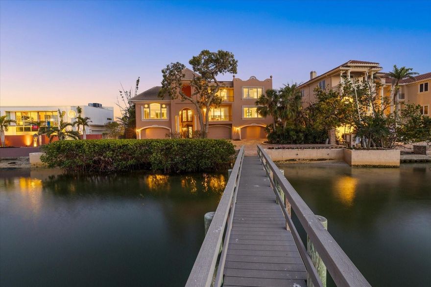 Welcome to 1364 Point Crisp, a breathtaking waterfront home on one of the most private and interesting streets on Siesta Key. With only seven homes on this secluded section of road, you’ll enjoy peace, quiet, and incredible views of Little Sarasota Bay and the Intracoastal Waterway. Watch sailboats glide by or fishermen return from a great day out in the Gulf. This home is a boater’s dream, featuring a 16,000# boat lift and a 10,000# personal watercraft lift not to mention a separate day dock and kayak Launch in the back yard. The heated saltwater pool was custom built and features a spacious deck, and plenty of room to entertain family and friends. Relax on one of the two large second-floor balconies with an outdoor grill area and roll-down screens—perfect for enjoying a glass of wine while watching the sunset. Other features include: a 100KW Kohler commercial backup generator powered by natural gas, Impact-rated doors and windows, well water for irrigation and city water access at multiple points, including the dock. Six climate-controlled garage spaces plus tons of extra storage on the first level, with easy access to the backyard and pool. Inside, with an elevator serving all levels of the home, you’ll find 4 spacious bedrooms, 5 full bathrooms, and a modern kitchen with a Sub-Zero refrigerator, Thermador induction cooktop, and GE Monogram appliances. The wet bar includes a beverage fridge and extra storage—perfect for entertaining. This home has been meticulously maintained and offers countless hidden conveniences that make life easier. Don’t miss your chance to own this incredible waterfront retreat!