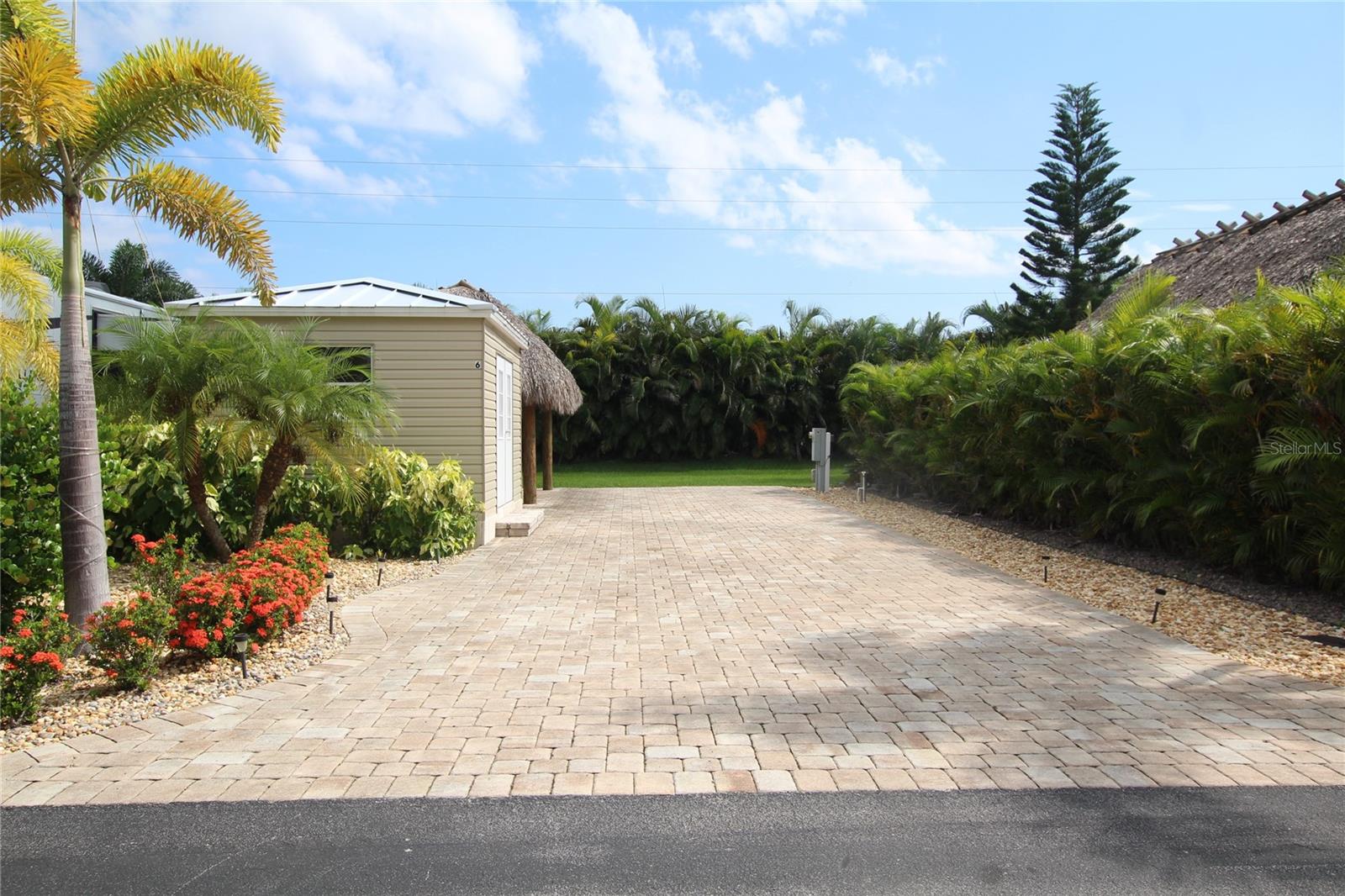 Welcome to paradise! This stunning five-star resort offers a vibrant, active community with an abundance of amenities to enjoy. With larger-than-average lots, you'll have plenty of space to relax and entertain. The resort features a member's clubhouse, pool, bar and grill, and pickleball courts—perfect for staying active and socializing.
This particular lot comes with some fantastic extras: pavers for a stylish touch, a Casita (still in need of a little finishing), and a Tiki Hut for those tropical vibes. Whether you’re looking to unwind in luxury or engage in community activities, this resort has it all.