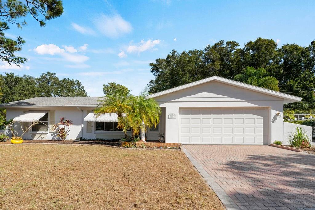 AMAZING OPPORTUNITY TO OWN THIS WELL CARED FOR 3 BEDROOM 2 FULL BATH HOME AT THE END OF A PRIVATE CUL DE SAC! SINGLE OWNER HAS OCCUPIED THIS PROPERTY FULL TIME FO YEARS! BEAUTIFUL YARD WITH GARDENS AND WILDLIFE TO WATCH! HOME HAS A LARGE LIVING ROOM,EAT IN KITCHEN, FAMILY ROOM, PRIMARY BEDROOM AND BATH, WALK IN CLOSET, NEW QUARTZ KITCHEN COUNTERTOPS, NEW CARPET, NEW FLOORING, NEW FLAT ROOF, HURRICANE SHUTTERS, BATHROOMS BOTH HAVE NEW QUARTZ COUNTERTOPS AND NEW FAUCETS AND PLUMBING, FLORIDA ROOM OFF THE BACK TO ENJOY THE PRIVATE BACKYARD, FENCED YARD, STORAGE SHED OUT BACK CREATES LOTS OF EXTRA STORAGE, 2 CAR GARAGE AND SO MUCH MORE! MUST SEE!