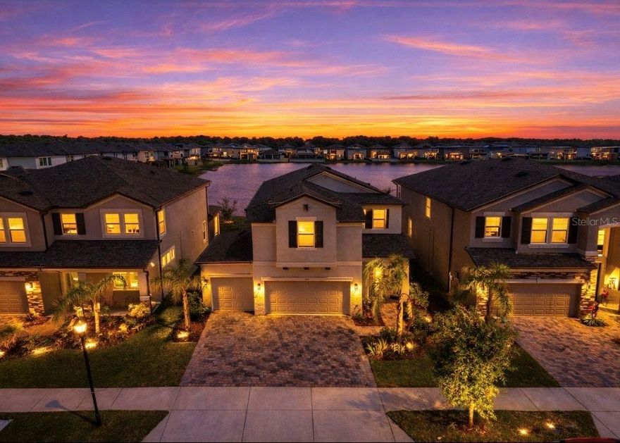 One or more photo(s) has been virtually staged. Welcome to Berry Bay in Wimauma—where you can skip the wait for new construction and move right into a better-than-new home.

Built in 2022, this highly sought-after Castellana floorplan offers over 2,600 square feet with 4 bedrooms, 3 full bathrooms, a loft, and a rare 3-car garage—something you simply don’t find in most homes at this price point.

Positioned on a pond lot with peaceful water views, this home delivers the space, layout, and upgrades today’s buyers are searching for—without the added cost, timelines, or uncertainty of building.

The open-concept design is bright and functional, centered around a well-appointed kitchen featuring granite countertops, 42-inch cabinets with crown molding, stainless steel appliances, a large island with breakfast bar, and a walk-in pantry overlooking the main living and dining areas.

A first-floor bedroom and full bathroom offer flexible living options for guests, a home office, or multi-generational needs.

Upstairs, the spacious owner’s suite includes dual vanities, a walk-in shower, private water closet, and a large walk-in closet. Two additional bedrooms, a full bathroom with dual vanities, and a versatile loft provide room to spread out, work, and live comfortably. The second-floor laundry room adds everyday convenience.

Step outside to a covered lanai overlooking the water—perfect for quiet mornings or unwinding at the end of the day.

Additional features include wood-look tile flooring, epoxy-coated garage floors, paver driveway, EV charging outlet (NEMA 14-50), SmartShield whole-home security system, and a built-in pest defense system.

Located in an X flood zone with no flood insurance required and a low HOA of just $90 annually, Berry Bay offers resort-style amenities including a community pool, clubhouse, pickleball and basketball courts, and playground.

Conveniently located with easy access to Tampa, Sarasota, and St. Petersburg, as well as nearby shopping, dining, and major roadways.