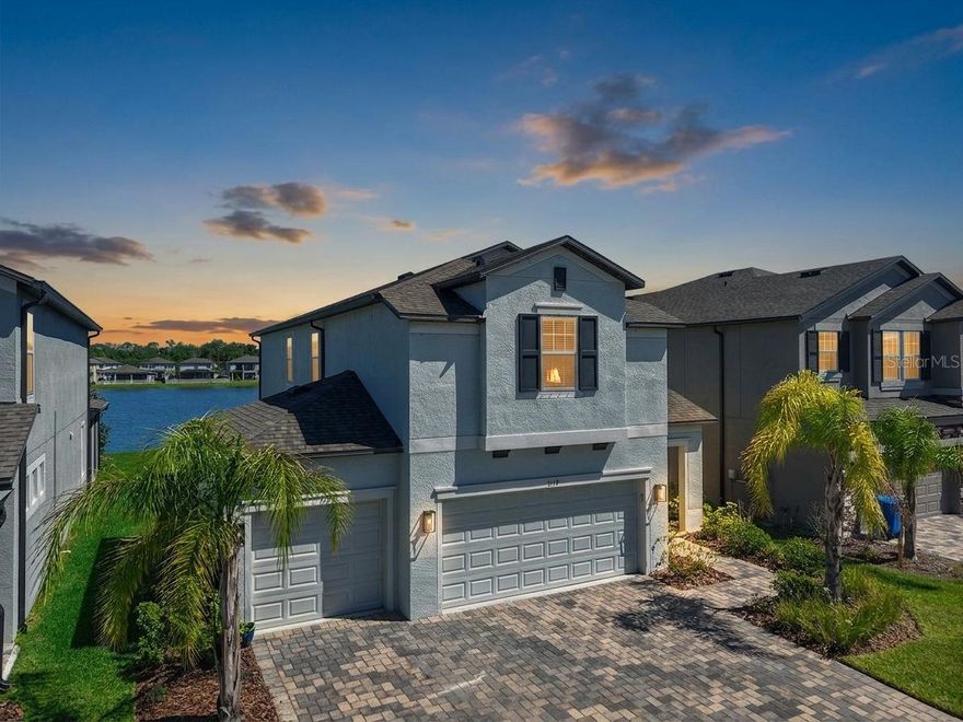 One or more photo(s) has been virtually staged. Welcome to Berry Bay in Wimauma—where you can skip the wait for new construction and move right into a better-than-new home.

Built in 2022, this highly sought-after Castellana floorplan offers over 2,600 square feet with 4 bedrooms, 3 full bathrooms, a loft, and a rare 3-car garage—something you simply don’t find in most homes at this price point.

Positioned on a pond lot with peaceful water views, this home delivers the space, layout, and upgrades today’s buyers are searching for—without the added cost, timelines, or uncertainty of building.

The open-concept design is bright and functional, centered around a well-appointed kitchen featuring granite countertops, 42-inch cabinets with crown molding, stainless steel appliances, a large island with breakfast bar, and a walk-in pantry overlooking the main living and dining areas.

A first-floor bedroom and full bathroom offer flexible living options for guests, a home office, or multi-generational needs.

Upstairs, the spacious owner’s suite includes dual vanities, a walk-in shower, private water closet, and a large walk-in closet. Two additional bedrooms, a full bathroom with dual vanities, and a versatile loft provide room to spread out, work, and live comfortably. The second-floor laundry room adds everyday convenience.

Step outside to a covered lanai overlooking the water—perfect for quiet mornings or unwinding at the end of the day.

Additional features include wood-look tile flooring, epoxy-coated garage floors, paver driveway, EV charging outlet (NEMA 14-50), SmartShield whole-home security system, and a built-in pest defense system.

Located in an X flood zone with no flood insurance required and a low HOA of just $90 annually, Berry Bay offers resort-style amenities including a community pool, clubhouse, pickleball and basketball courts, and playground.

Conveniently located with easy access to Tampa, Sarasota, and St. Petersburg, as well as nearby shopping, dining, and major roadways.