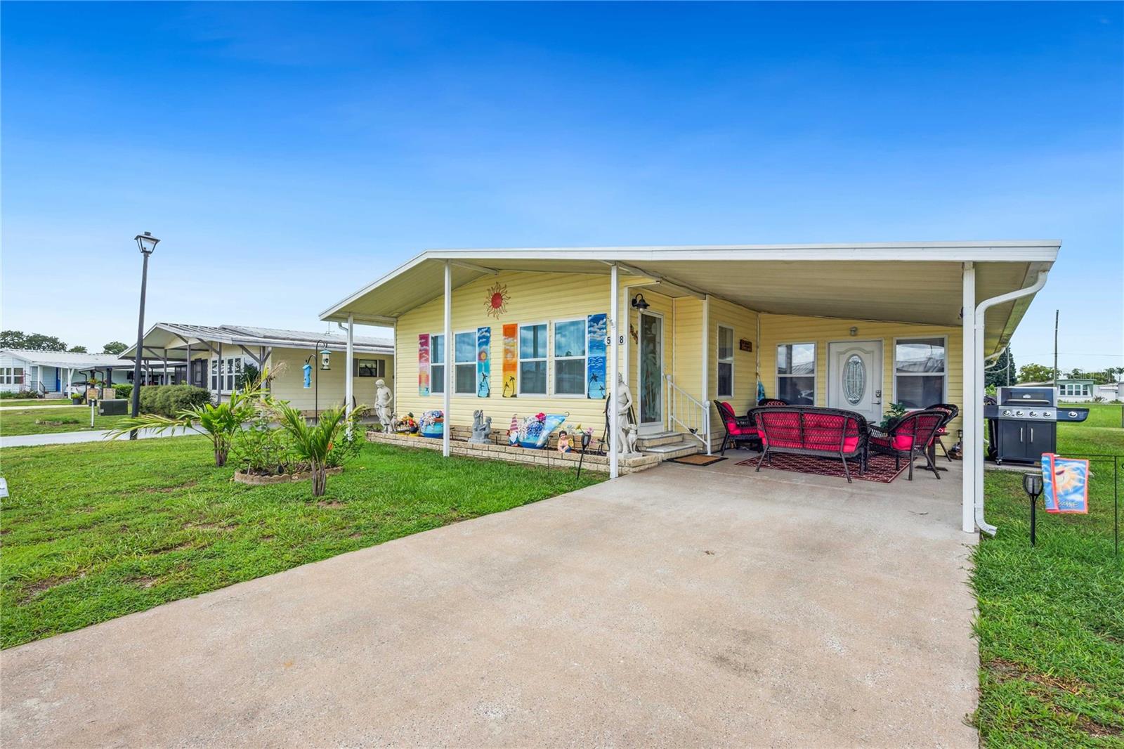 Welcome to Oaks Royal III – an active 55+ pet-friendly community where you own the land for a low annual HOA fee of just $800. Whether you're looking to escape the cold for a few months or settle into your forever retirement home, this beautifully updated 2-bedroom, 2-bathroom residence on a quiet cul-de-sac is sure to impress! From the moment you arrive, you’ll notice the lovely curb appeal and peaceful setting. Step inside to find a spacious open floor plan that seamlessly connects the kitchen, dining, and living areas – perfect for entertaining or relaxing. The kitchen features solid wood cabinets, updated countertops, and newer stainless-steel appliances, making it a chef’s delight. The living room offers a cozy electric fireplace for added ambiance. An added bonus is the Florida room, fully integrated into the central A/C system for year-round comfort. With laminate flooring and a ceiling fan, it’s an ideal space to unwind with a good book or entertain guests. The primary bedroom is spacious and includes a ceiling fan and ensuite bathroom with a step-in shower. The second bedroom features a built-in closet and is conveniently located across from the guest bathroom, which includes an updated vanity, vinyl flooring, and a tub/shower combination. A sought-after feature is the inside laundry area, complete with extra storage—no more hauling laundry up and down stairs. Just off the Florida room is a 10x12 storage room, perfect for holiday décor, tools, or hobbies. Additional highlights include: Laminate flooring throughout most of the home. Double-pane windows. 2017 central A/C system. Pet-friendly for dogs 20 lbs or less. Enjoy the friendly and welcoming atmosphere of Oaks Royal III, conveniently located near shopping, restaurants, and medical facilities. Don’t miss your chance to own this well-maintained home—schedule your private showing today!