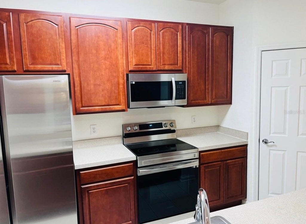 Photo of 8775 Sartori Street #301, Orlando, FL 32829 (MLS # O6437563)