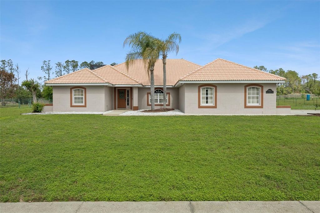 Photo of 7833 Golf Paradise Way, Clermont, FL 34711 (MLS # O6396447)