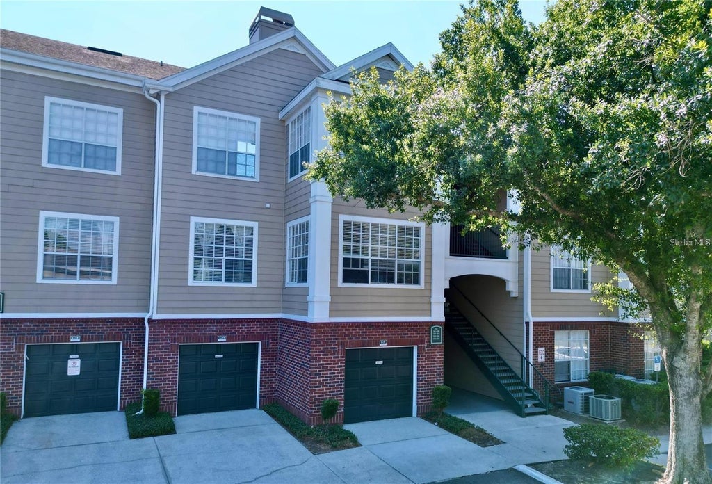 Photo of 13025 Mulberry Park Drive #332, Orlando, FL 32821 (MLS # OM733740)