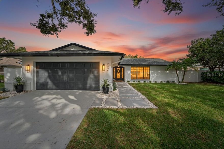 Impeccably renovated and truly turn-key, this 3-bedroom, 3-bath home with a dedicated office is ideally located in the prestigious Clubhouse Estates of Countryside. Offering 2,068 sq ft of refined living, every major system and surface has been thoughtfully updated, creating a rare “everything-done” opportunity in one of Clearwater’s most desirable communities.
Recent 2025 upgrades include a complete whole-home replumb with all new piping in walls and ceilings, a new water service line to the garage with shutoff valve, fresh interior paint, full popcorn ceiling removal, new laminate flooring in the office and third bedroom, refreshed guest bath with new counters, fixtures, and toilets, plus a brand-new microwave and range. The garage has been finished with sleek epoxy-flake flooring.

The exterior underwent a full transformation in 2023 with a new architectural roof, new seamless gutters with leaf protection, freshly painted exterior, a stunning 12x24 custom wood pergola with designer tile paver patio, new white vinyl fencing, professional landscaping, an enhanced front walkway, Rain Bird smart irrigation system, complete sprinkler overhaul, new well pump, and updated exterior lighting. A new HVAC system was installed in 2022.

Originally renovated in 2020, the gourmet kitchen features white quartz countertops, custom shaker cabinetry, soft-close drawers, specialized pull-outs, lazy Susan, dual trash/recycle system, stainless double sink, stainless appliances, and a custom handmade backsplash. The primary suite offers a beautifully redesigned bath and custom walk-in closet system. Additional highlights include premium LVP flooring, recessed lighting, upgraded fixtures and fans, custom window treatments, and a fully outfitted laundry room with cabinetry, sink, folding station, and LG washer/dryer with pedestals.

Hurricane protection panels and a front door cover provide peace of mind.

Located within walking distance to Countryside Country Club and minutes to Countryside Mall, top dining, both Tampa International and St. Pete–Clearwater airports, and world-famous Clearwater Beach. Non-flood zone, non-evacuation area. A prime Clearwater lifestyle with every upgrade already completed.