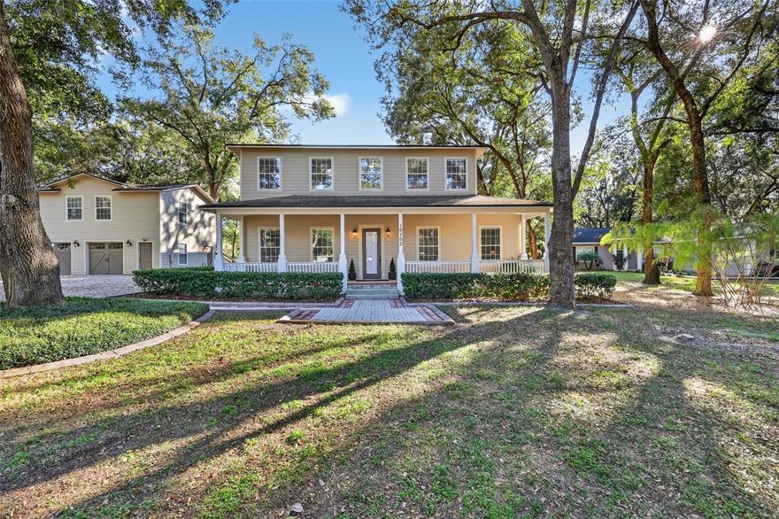 ~ Rural Paradise Awaits! ~ This meticulously maintained, custom-built, multi-generational home is set on a private 1-acre lot in a peaceful rural setting. The spacious and versatile layout offers 7 bedrooms and 4.5 bathrooms, including a KING-sized primary suite on the main level featuring two walk-in closets, a beautiful bay window, and a spa-like ensuite bathroom with a clawfoot tub and LARGE walk-in shower, creating a private oasis! An additional bedroom and full bathroom downstairs provide ideal accommodations for elderly guests or extended family.
The main level also includes a second downstairs living room, offering flexible space that could easily serve as a formal dining room.
A separate, fully equipped apartment above the detached garage includes a full kitchen, living room, bedroom, and full bathroom, along with its own screened porch, providing excellent flexibility for multi-generational living or guests. 
At the heart of the home is a chef’s kitchen, thoughtfully designed with a cooking island, built-in ovens, and two sinks, perfect for both everyday living and entertaining. The kitchen opens to the great room with soaring ceilings, a custom built-in entertainment wall, and 2 sets of French doors, creating a seamless flow for gatherings and indoor-outdoor living.
The upper level of the main home features four bedrooms, a Jack-and-Jill bathroom, a cozy reading nook, and an office or craft room. The largest upstairs bedroom includes a 1/2 bath, 2nd laundry space, and a covered screen-enclosed porch, providing an additional private retreat. Outdoor living spaces are further enhanced by a large wrap-around screened lanai and a welcoming front porch, ideal for enjoying the surrounding countryside.
Designed for comfort and functionality, the property includes two laundry rooms, a propane-powered whole-house generator, and a water purification system, offering added convenience and peace of mind for rural living.
With generous room sizes, abundant indoor and outdoor living areas, and a truly private setting, this exceptional property is perfectly suited for multi-generational living, entertaining, or those seeking space, privacy, and versatility....NO backyard neighbors, only trees and serenity.  Bring your boat, RV, or recreational vehicles, because there is plenty of room & NO HOA! Call today and make this unique property your own. *All information contained herein subject to change without notice to include any fees associated with property. Buyer to satisfy themselves of any/all room measurements. All information TBV by Buyers.*