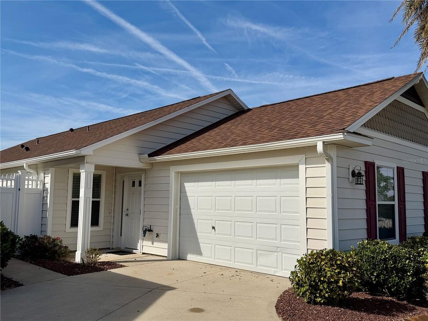 MORE PHOTOS TO COME! Experience refined Florida living in this TURNKEY, FULLY-FURNISHED, immaculately maintained courtyard villa nestled in the highly sought-after VILLAGE OF PENNECAMP. This prime location is situated between SUMTER LANDING and BROWNWOOD PADDOCK SQUARE- a golf cart ride away from shopping, dining, and entertainment.  Designed for both comfort and style, this OPEN-CONCEPT floor plan seamlessly connects the living room and dining area to the SPACIOUS KITCHEN which features abundant WHITE CABINETRY with PULLOUTS and a convenient BREAKFAST BAR – ideal for everyday living and entertaining.  This 3-bedroom, 2-bath residence features soaring VOLUME CEILINGS and a BRIGHT, OPEN LAYOUT with NO CARPETING throughout. Laminate flooring and ceramic tile add a modern, cohesive feel.  Recent upgrades—including a 2023 ROOF and 2019 HVAC—provide lasting peace of mind. Step outside to your FULLY FENCED, PRIVATE PATIO WITH BIRDCAGE—an inviting retreat ideal for morning coffee, evening relaxation, or hosting guests. This home is less than a 10 minute GOLF CART RIDE to 9 EXECUTIVE GOLF COURSES AND 2 CHAMPIONSHIP GOLF COURSES.  With resort-style pools, recreation centers, tennis, pickleball, country clubs, dining, and shopping-- an exceptional lifestyle in one of The Villages’ most desirable locations awaits you!  A 2015 YAMAHA GOLF CART with under 3,000 MILES is included. Garage can accommodate one car, a golf cart, and has storage cabinet.