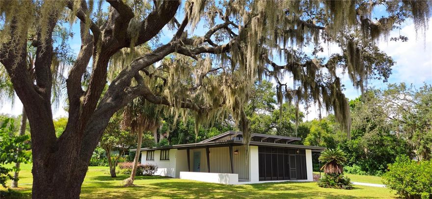 Bespoke, One of a Kind...whatever you want to call home, your friends and neighbors will love this one! A true 1953 Mid-Century Modern  home featuring tons of natural light and materials. The main living area, with a wall of windows and heavy wood sliders, fully open to let the outside in. Wood beams, tongue n' groove ceiling and Clerestory windows will draw your eye upward. The adjacent kitchen has been updated to include maple cabinetry, stainless steel appliances and solid surface countertops. The primary and secondary bathrooms have been maintained in excellent condition to retain their original character. And a peaceful laundry room with lots of storage in the attached carport. Situated on a large corner lot and just 4 homes away from Lake Harris, where you will enjoy your evening strolls along the lakefront pathway. Town park and boat launch/pier is just a few blocks over. Howey in the Hills IS small town America with easy access to Florida's Turnpike, downtown Tavares (America's Seaplane City) or the Famous Yalaha Bakery. Mechanical ages are Roof 2019, AC 2018, HWH 2020. They don't build them like this anymore!