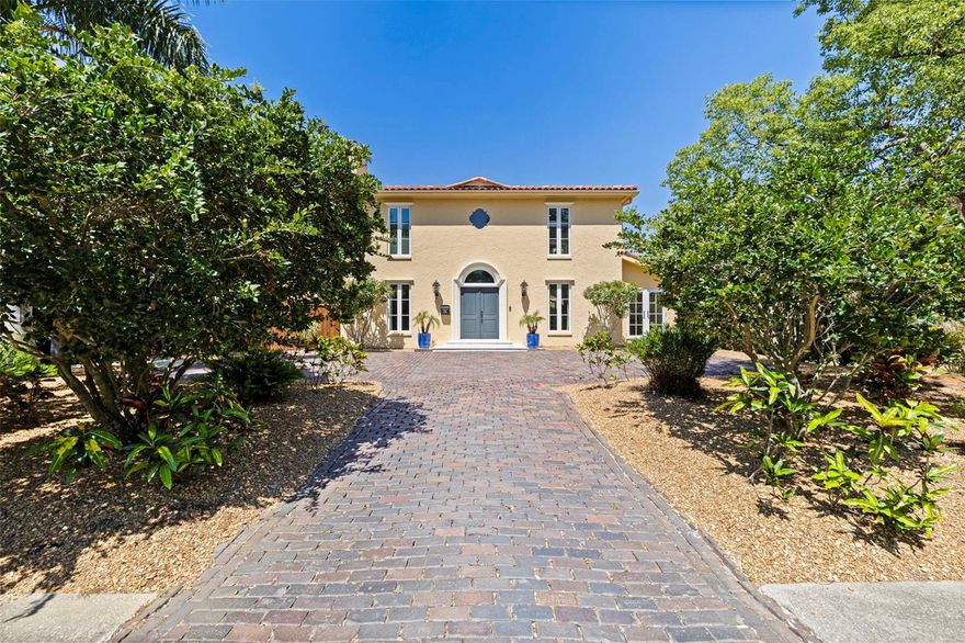 Nestled along one of the most iconic brick-lined streets in the coveted Jungle Prada neighborhood, this extraordinary Mediterranean-inspired residence blends timeless architectural character with an impressive collection of modern upgrades. Just two blocks from the sparkling waters of Boca Ciega Bay and only minutes from the Gulf beaches, this one-of-a-kind property offers the perfect balance of historic charm, luxury living, and the laid-back coastal lifestyle that defines St. Petersburg.

Originally designed by renowned architect David Tudeen as his personal residence and thoughtfully reimagined over the years, the home showcases striking architectural details throughout—from soaring ceilings, dramatic archways, and pecky cypress beams to elegant French doors, rich wood flooring, and beautifully curated living spaces. The spacious floorplan offers 3 bedrooms, 3.5 bathrooms, a newly added fully permitted office, and an oversized 2-car garage with mudroom connection, creating both versatility and functionality for today’s lifestyle.

At the heart of the home, the expansive chef’s kitchen has been enhanced with stunning quartz surfaces, upgraded fixtures and hardware, and premium GE Monogram appliances including a gas range, refrigerator, dishwasher, and microwave—perfectly complementing the warm yet sophisticated atmosphere ideal for entertaining. The adjoining living and family spaces flow seamlessly to the outdoor living areas, where an entirely transformed backyard oasis awaits.

Completed in 2024, the brand-new pool by Oasis Pools (integrated with both heating and cooling systems) creates a true private retreat surrounded by lush landscaping, new fencing, fresh pavers, and turf enhancements that elevate both beauty and privacy. Whether hosting guests under the stars or enjoying a peaceful afternoon poolside, the outdoor setting feels like a luxury resort tucked within one of St. Pete’s most unique neighborhoods.

The upstairs primary suite serves as a luxurious sanctuary complete with fireplace, Juliet balcony, wet bar, wardrobe room, and spa-like bath, while both guest bedrooms feature walk-in closets, generous proportions, en-suite access, and exceptional storage rarely found in homes of this architectural era. Modern conveniences continue throughout the home with smart-home wiring, a whole-house generator, new HVAC system, newly installed tile and flat roofs, and extensive recent capital improvements that provide both peace of mind and long-term value.

Beyond the property itself, Jungle Terrace is beloved for its rich history, winding brick streets, lush tropical canopy, and famously charming resident peacocks that wander the neighborhood. Outdoor enthusiasts will appreciate the proximity to waterfront parks, boating access, and multiple nearby high-and-dry boat storage facilities, while downtown St. Petersburg, waterfront dining, marinas, and world-class beaches remain just moments away. This is a rare opportunity to own a truly distinctive residence in one of St. Pete’s most enchanting hidden-gem neighborhoods.