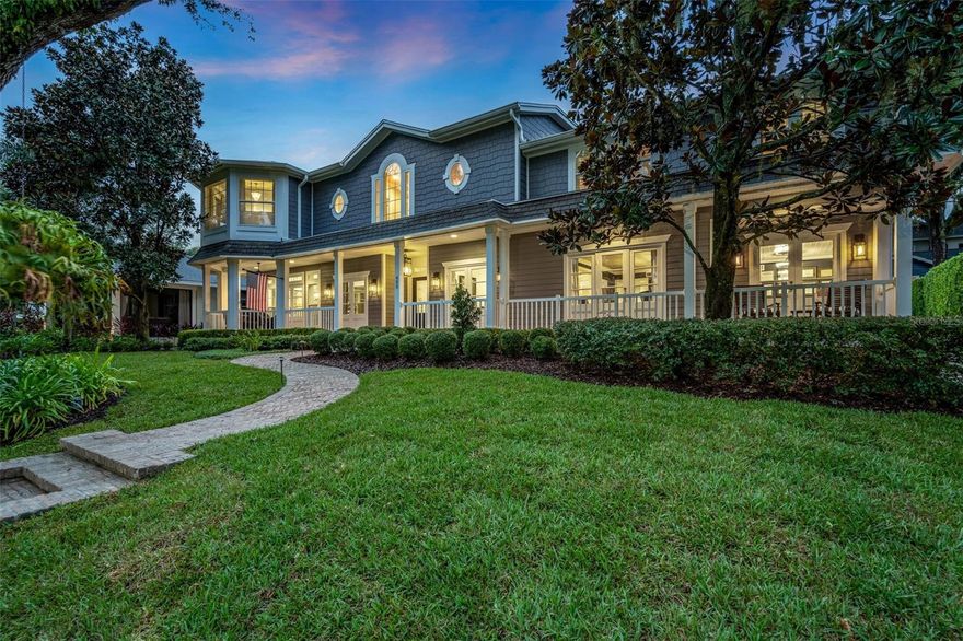 Stunning Lakefront Estate with Unmatched Craftsmanship and Timeless Elegance. Welcome to this extraordinary Cape Cod-inspired estate, perched above picturesque Lake Ivanhoe with sweeping views of the downtown Orlando skyline. This 5,811 sq ft masterpiece is a blend of timeless design and modern luxury, offering everything you’ve dreamed of in a home.. As you step through the grand entrance, be prepared to be captivated by the soaring two-story ceiling, a stunning staircase, and the exquisite woodwork that adorns every corner. The home boasts 4 spacious bedrooms, 3.5 beautifully appointed bathrooms, and two versatile office spaces—one of which could easily serve as a 5th bedroom. 
The home’s layout effortlessly combines elegance and comfort. The spacious chef's kitchen is a culinary dream, featuring top-of-the-line appliances, a large picture window overlooking the sparkling pool, and a seamless connection to the informal dining area and family room, which boasts a custom dry bar—perfect for entertaining. Adjacent to the kitchen, the butler's pantry provides an exceptional level of convenience with a secondary dishwasher, oven, and its own laundry area, making hosting large gatherings a breeze. Additionally, a walk-in pantry provides ample storage. Serenity abounds throughout the home, with breathtaking lake views from nearly every room. The expansive screened-in patio offers a seamless transition to outdoor living, perfect for al fresco dining by the heated saltwater pool and outdoor fireplace.

As you ascend the stairs, you are greeted by a serene sitting area with floor-to-ceiling windows that capture the peaceful beauty of Lake Ivanhoe.
The primary suite is a true sanctuary, featuring an oversized sitting area, custom his-and-hers closets, and a spa-like bathroom with heated Calcutta Gold marble floors, a soaking tub, and a multi-head steam shower. A private laundry room and an additional office or gym space add convenience to this serene retreat. Beyond the sitting area, a true loft space awaits—perfect for a playroom, media center, or additional workspace. This space leads to three generously sized bedrooms, including an impressive junior suite with its own custom walk-in closet, luxurious ensuite bath with Carrara marble and a stunning stained-glass window.

Every detail of this home has been thoughtfully designed, from the extensive use of crown molding and shiplap to the floor-to-ceiling windows that flood the home with natural light. The Cape Cod charm is highlighted by a sprawling 70-ft front porch, elegant herringbone brick walkway, and beautifully landscaped grounds with indirect lighting.

Located just steps from the heart of downtown Orlando, this home is walkable to popular shops, dining, and top-rated schools, including Lake Highland Prep and Bishop Moore. Enjoy the best of both worlds with the tranquility of lakefront living and the convenience of city life. This is the home that checks every box on your wish list—don’t miss your chance to make it yours.
