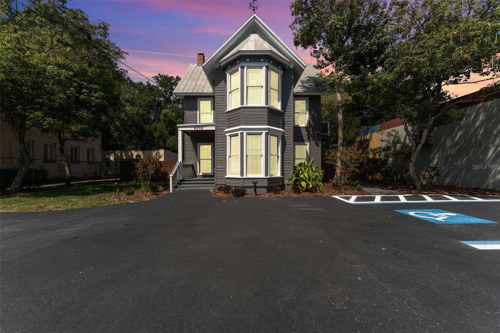 This turnkey two-story office building offers an exceptional opportunity just minutes from Downtown Tampa. Located in the highly sought-after Seminole Heights neighborhood, the property provides a flexible layout with multiple office configurations, three restrooms, and a full kitchen/breakroom. A detached garage offers additional storage or workspace, making it ideal for businesses that require inventory or equipment on-site. The expansive, fully fenced backyard creates space for outdoor work areas, team gatherings, or potential future expansion. Onsite parking ensures convenience for staff and visitors, and the property benefits from excellent visibility and signage opportunities. Owners also have the ability to lease out the second story separately, creating an additional income stream or allowing for a live/work or shared-office setup. Its prime location places it near major commuter routes, including I-275, and within walking distance of Seminole Heights’ popular restaurants, retail, and professional services. This property is well-suited for professional offices, medical practices, creative studios, co-working spaces, or boutique agencies looking to establish a presence in a vibrant, growing area.