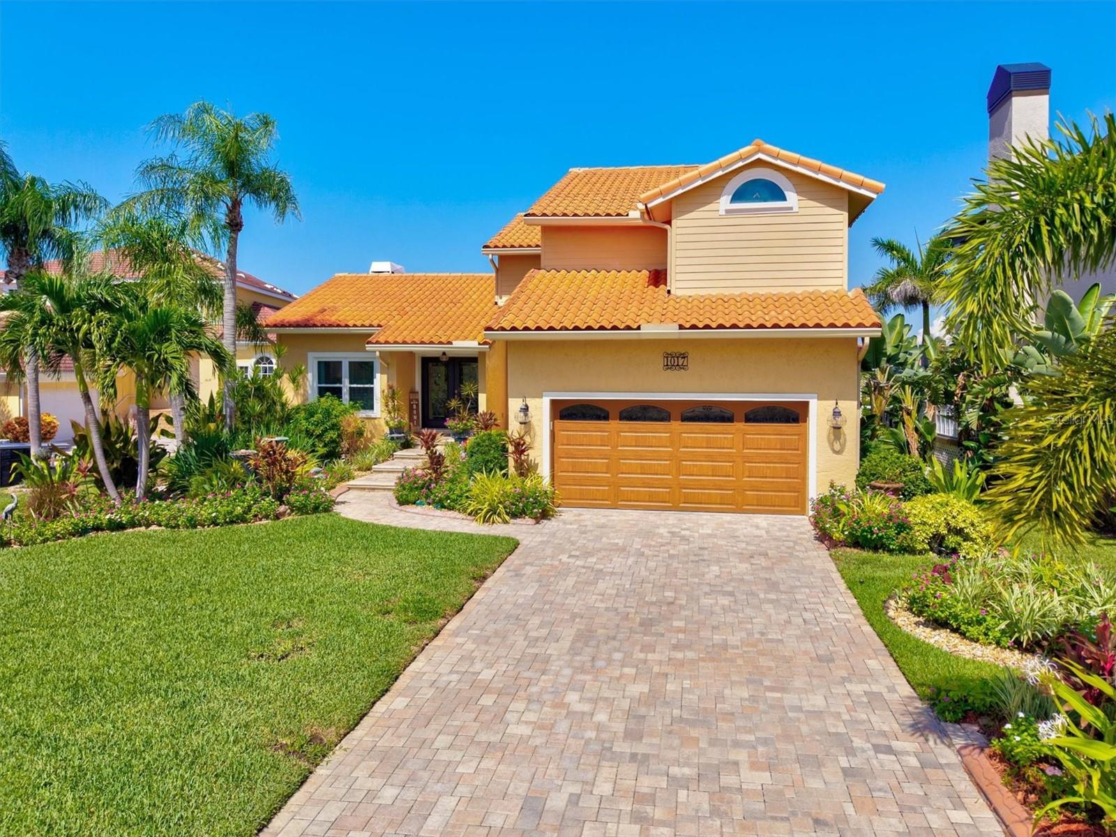 One or more photo(s) has been virtually staged. Luxury Living on The Bay! This beautifully updated 4-bed, 3-bath Apollo Beach WATERFRONT home, located in the gorgeous GATED COMMUNITY of Symphony Isles, offers direct water access to TAMPA BAY and an array of upgrades designed for comfort, style, and peace of mind that truly showcase that Florida charm. Step inside to find a cozy WOOD BURNING FIREPLACE with a new stone-tile surround and heat exchanger, LUXURY VINYL FLOORING throughout the first floor, and all new recently updated bathrooms. Spend your time cooking and hosting in the completely remodeled kitchen featuring GRANITE COUNTERTOPS, tall pantry cupboards with pull-out drawers, and BRAND NEW 2025 STAINLESS STEEL APPLIANCES including refrigerator, dishwasher, and built-in microwave drawer. But it doesn’t end there…additional highlights include NEW WASHER AND DRYER, all-new window treatments, and thoughtfully designed spaces throughout. Enjoy peace of mind with full home hurricane protection that includes a new double front door with a remote operated ELECTRIC HURRICANE SHUTTER, all-new HURRICANE IMPACT DOORS AND WINDOWS throughout, a new hurricane impact garage door with new garage door opener, and a HOME GENERATOR. Outdoors, enjoy a private paradise with a freshly resurfaced HEATED SALTWATER POOL accented by new tile, updated paver driveway and pool deck, a new pool heater pump, freshly laid sod, and lush landscaping. The backyard is perfect for entertaining with a NEW STAINLESS STEEL OUTDOOR KITCHEN, new indoor and outdoor lighting, and an upstairs deck completely redone in 2025. Waterfront enthusiasts will love the NEW CONCRETE SEAWALL, updated COMPOSITE BOAT DOCK with FLOATING DOCK for jet skis or kayaks, and a BRAND NEW BOAT LIFT capable of holding up to an 18,000 lb vessel. With every major update complete, this home is truly move-in ready—offering the perfect blend of modern upgrades, timeless design, and direct access to the best of Florida waterfront living. Explore what the incredible community of Symphony Isles has to offer which includes 24-HOUR UNIFORMED SECURITY, a clubhouse, community pool, children’s playground, private beach on Tampa Bay, boat launch area, horseshoe pit, beach volleyball court, barbecue area and gazebo. Symphony Isles is conveniently located only a short drive to interstate 75. Tampa, downtown St. Petersburg, St. Pete Beach and Sarasota are easy commutes and offer the residents great shopping, performing arts, professional sports, world-class museums, fine dining, nightlife and the top-rated Gulf Coast beaches and not to mention, it’s also within close proximity to several championship golf courses. Schedule your tour today to see what this beautiful home has to offer!