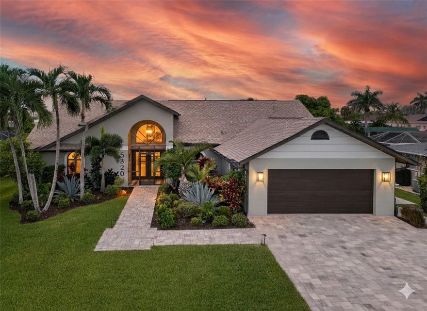 ONE-OF-A-KIND IN CAPE CORAL! SIMPLY STUNNING 3 BEDROOM, 3 BATH, 2-CAR GARAGE WATERFRONT POOL HOME WITH QUICK ACCESS TO THE CALOOSAHATCHEE RIVER LEADING TO THE GULF! NO FLOOD DAMAGE OR FLOOD CLAIM FROM HURRICANE IAN. 80’ of waterfrontage with 60’ Trek dock, water, electric and 7,500 lb. boat lift for the avid boater. Professionally decorated with high end accents and rich architectural details captured in every room of this amazing home! Beautiful iron doors lead inside to an open floor plan featuring high ceilings, contemporary décor, modern lighting, imported Italian tile floors, separate office with glass door entrance and light and bright living and dining space exuding coastal luxury.  Gourmet chef’s kitchen offers leathered quartz counters, custom cabinetry, stainless appliances, breakfast bar and barn doors leading to separate coffee bar. Designer primary suite is a haven for relaxation featuring access to lanai and luxurious en-suite. Split floor plan gives plenty of privacy for guests featuring inviting bedrooms and separate updated guest bath with custom tiled walk-in shower. Large inside utility room features high end washer and dryer and extra space for storage. Step outside to an exceptional entertaining area featuring covered lanai with custom ceiling and accents making this a comfortable space for entertaining, nighttime exterior lighting, convenient pool bath and screened heated deep pool overlooking outside patio and paver walkway to dock. Northwest exposure to enjoy gorgeous sunsets. Hurricane impact windows, iron front door, StormSmart screens and new roof in 2022 provide ultimate peace of mind. New lush landscaping, extended paver driveway and walkways plus soffit and exterior lighting add to the enhanced curb appeal. Not one detail has been overlooked in this truly impressive home.  Great location minutes from Tarpon Point Marina and downtown Cape Coral with fine dining and shopping, fishing, boating plus close to great schools and a short drive to Fort Myers and gulf coast beaches. This home is truly a masterpiece! Don’t miss this opportunity! Schedule your private showing today! See attached for extensive list of seller upgrades and features.