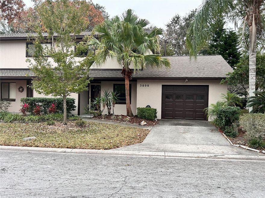 Welcome to this thoughtfully designed two-story villa in The Village North, offering a rare and highly desirable dual primary suite layout—perfect for multi-generational living, extended guests, or added flexibility. One primary suite is conveniently located on the main level, with a second private suite upstairs.

The main living area features soaring cathedral ceilings, tile flooring, and a cozy wood-burning fireplace that creates a warm, inviting atmosphere. The open layout flows seamlessly into the dining area and updated kitchen, making it ideal for both everyday living and entertaining.

The main-floor primary suite is generously sized and includes a walk-in closet, an updated en-suite bath with a walk-in shower, and sliding glass doors that open to a screened and enclosed back porch—perfect for relaxing year-round. Upstairs, the second primary suite offers its own walk-in closet and private bathroom with a walk-in shower, providing comfort and privacy for guests or family members.
Additional highlights include a convenient half bath on the main level and an oversized storage area tucked beneath the staircase, offering exceptional storage space. Move-in ready and full of charm, this home combines comfort, functionality, and versatility in a prime Ocala location.