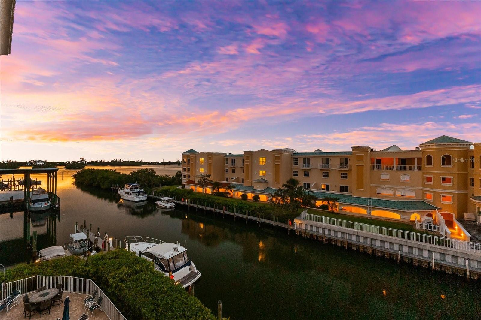 Luxury waterfront penthouse with deep water marina access. Discover Osprey Harbor Village, an exclusive gated condo community of only 53 residences perfectly positioned along Florida’s sparkling Intracoastal Waterway. This stunning 3 bedroom, 2 bath penthouse offers nearly 2,000 square feet of thoughtfully designed living space plus a generous 290 square foot tiled terrace with expansive views of the marina, the Intracoastal Waterway, and Sarasota Bay. From the moment you enter, you are welcomed by natural light, soaring 9.5 foot ceilings, and an open, flowing floor plan. Watch dolphins and manatees pass by, admire the rowers from your bedroom, and enjoy unforgettable sunsets from your private balcony every evening. This is the lifestyle you have been waiting for. The split bedroom layout offers privacy and function, while upscale finishes set this residence apart. Enjoy travertine and ceramic tile floors, crown molding, granite counters, solid wood cabinetry, and stainless appliances. The spacious primary suite features tranquil water views, a walk in shower, jetted spa tub, and large walk in closet. Additional highlights include two deeded indoor garage parking spaces, private storage, and impact rated windows throughout. The building was constructed to the highest hurricane standards, and a brand new metal roof was just installed. Osprey Harbor Village is a well-constructed, sustainability-focused community that has been thoughtfully maintained, with a strong association committed to its continued care and management. The amenities are unmatched. Residents have access to a full service marina with wet and dry slips, a kayak launch, fishing dock, and bait and tackle shop right on site. Relax at the heated pool, soak in one of the two spas, or unwind in the sauna and steam rooms after a workout in the state of the art fitness center. Host a gathering in the stylish clubhouse with a full kitchen, TV lounge, and billiards table. There is secure indoor kayak and bike storage, a package delivery room, on site daily management, and controlled access for peace of mind. Located on the highly desirable Quiet Coast between Sarasota and Venice, Osprey Harbor Village is minutes from Siesta Key, Nokomis Beach, and the soft sands of Casey Key. Walk or bike to the Legacy Trail, enjoy nearby waterfront restaurants, golf courses, and boutique shopping. Whether you are a year round resident or seeking a luxurious seasonal retreat, this penthouse offers a rare opportunity to live above it all in one of Sarasota’s most exclusive waterfront communities. Make your appointment today and come see what life is like at the top. This is coastal living redefined.