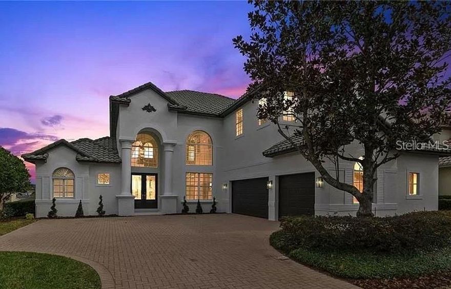 Discover luxury living at its finest in this fully renovated, never-lived-in smart home located in the prestigious Providence Golf and Country Club, one of Central Florida's most exclusive gated communities. This stunning five-bedroom, four-bathroom residence offers an impressive 4,136 sq. ft. of space, featuring a rare climate-controlled three-car garage, making it perfect for luxury vehicles, a home gym, or additional storage. Step inside to experience an elegant modern open layout adorned with premium finishes and smart appliances. The gourmet kitchen is a chef's dream, complete with a wine fridge, custom cabinetry, designer lighting, and tasteful gold accent touches. The main living area boasts soaring ceilings and an abundance of natural light, creating a warm and inviting atmosphere. Retreat to the owner's master suite, designed for relaxation, featuring a luxurious soaking tub for two, a spacious walk-in shower, dual vanities, and picturesque views of the stunning outdoor pool area. The oversized guest bathroom also includes a generous walk-in shower for added convenience. Upstairs, you'll find four well-appointed bedrooms, a open loft area with a huge balcony overlooking the backyard. A dedicated office space is conveniently located downstairs off the kitchen. Step outside to your private luxury pool, framed by palm trees and modern tile features. The deck is perfect for entertaining or unwinding, while the screened-in lanai seamlessly blends indoor and outdoor living, providing a tranquil space for year-round enjoyment and privacy. Renovations were completed in 2024, ensuring a fresh and modern experience. This home is just 3 miles from the highly-rated Davenport School of the Arts, and approximately 20-30 minutes from the magical attractions of Disney World. Enjoy the peace of mind that comes with 24-hour gated security, and take advantage of community amenities, including an 18-hole championship golf course, resort-style pools, fitness centers, tennis courts, playgrounds, nature trails, and a clubhouse with dining and social events. This property offers an unparalleled lifestyle and is an unbelievable deal for the area. Don’t miss your chance to make this luxury home your own!