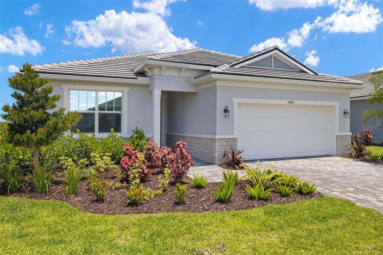 AVAILABLE NOW! This 1,909 sq. ft. Mandarin COASTAL Elevation, single-family home is welcoming and bright, on the PRESERVE. This home has 3 bedrooms 2 baths & a 2 car garage. You will appreciate the space and subtle styling touches from the beautiful Kitchen with corner walk-in pantry to the dining room and Great Room that overlook the extended lanai via the expansive 12-foot multi-sliding glass door. The Owner’s suite provides comfortable privacy, from a relaxing bath with split vanities, with a shower that has a bench seat, and linen closet to the large walk-in closet. This home has 8’ doors, which gives the open floor plan a look of high ceilings and allows plenty of natural light. This home has impact windows and doors, tile roof, and paver driveway. This home is situated on a lovely conservation homesite that offers privacy and invites you to relax and unwind. This Smart Home includes an Ecobee Smart Thermostat - Amazon Alexa compatible, Video Doorbell - with app, video recording and 2-way communication and ClareOne Touchscreen Panel! Wellen Park's only 55+ Community featuring future Amenity Center (21,000 sq ft) with 8 Pickle Ball Courts, 1 Stadium Court, 2 Pools (1 lap pool/1 resort style pool), State of the Art Fitness Facility, Bar and Cafe overlooking pools, dog park, Outdoor Exercise Lawn, Hot Tub, Full Time Lifestyle Director and so much more! Just minutes from beaches, Downtown Wellen Park, restaurants and shopping. This home is ready to move into immediately! Photos, renderings and plans are for illustrative purposes only and should never be relied upon and may vary from the actual home. Pricing, dimensions and features can change at any time without notice or obligation