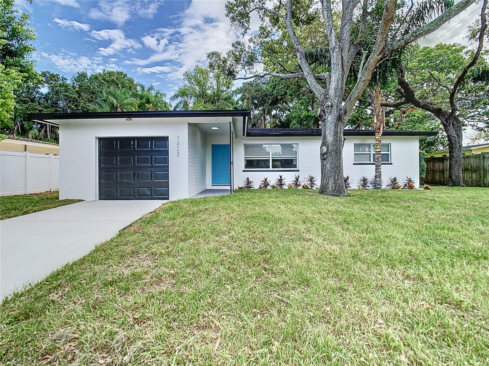 Talk about location!! Come see this tastefully fully updated, and modernized beauty in the non-flood part of Dunedin. This 3 bedroom 1.5 bath garage home has all the upgrades anyone can ask for. This hgome has a one year warranty included in the price, for your peace of mind. Newly painted inside and out with new interior and exterior light fixtures, luxury vinyl plank flooring throughout, and new interior doors with all-new hardware. Cook and entertain in your open-concept designer kitchen with new soft-close cabinetry, premium quartz countertops, featuring a stacked quartz stone front, and a built-in wine and beverage fridge. All new appliances to include refrigerator, microwave, dishwasher, and a new stove. Modern custom bathrooms featuring lighted mirrors. Enjoy a backyard BBQ on your pool-size lot featuring a screened-in porch. A new driveway, freshly landscaped, and to top the cake we have a new, June 2023 roof. It is no secret that Dunedin is also known to have some of the most delicious restaurants and breweries. Plus, world-class beaches and baseball teams are all part of Dunedin’s rich history. Be at award-winning Honeymoon Island State Park in ten minutes and enjoy real Florida. Ride your bike on the popular Pinellas Trail or to downtown Dunedin and enjoy shops, restaurants, waterfront views, biking, and hiking trails. This home comes with a 1-year warranty and is waiting for you. Schedule your appointment today. The seller is highly motivated!! All measurements are to be verified by the buyer.