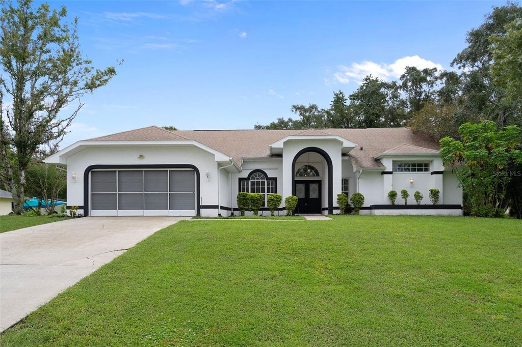 Photo of 201 Oak Lake Drive, Spring Hill, FL 34608 (MLS # TB8421597)