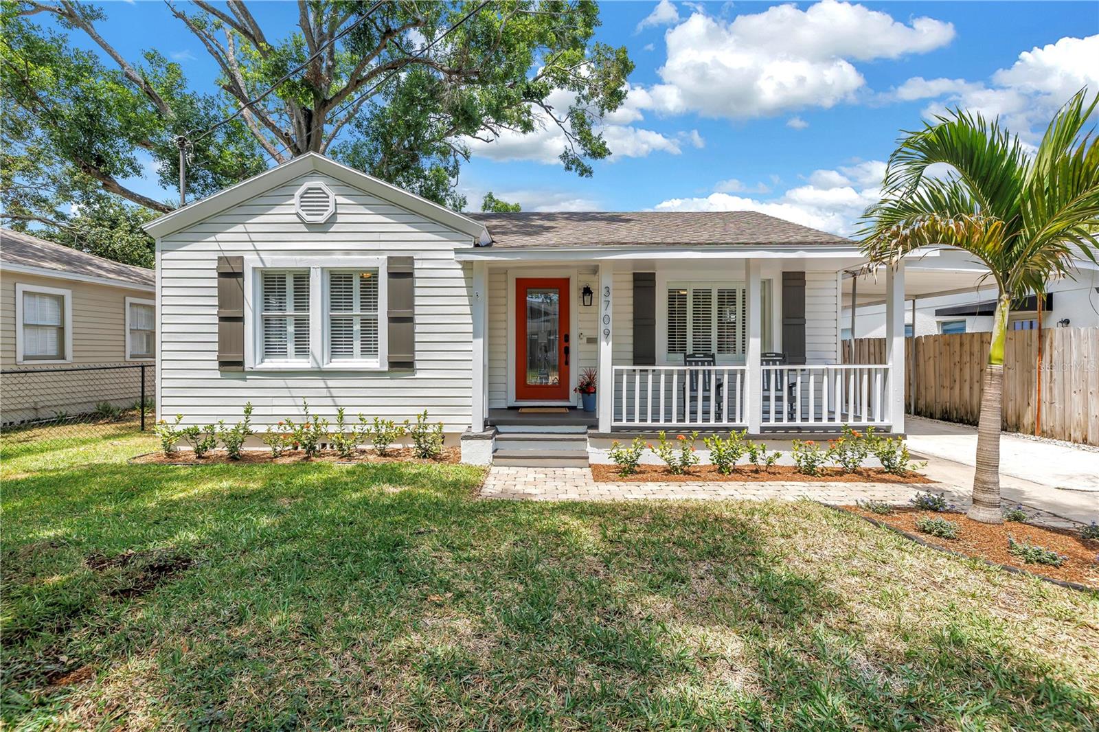 Charming 2 bedroom/1.5 bathroom BUNGALOW in South Tampa’s highly sought after VIRGINIA PARK neighborhood. This beauty has it all. As you pull up to this meticulously landscaped yard, you will fall in love right away with its inviting front porch, which will become one of your favorite spots of the home all year round! Step inside and you are greeted with lots of natural light through the beautiful picture window in the front living/sitting room. Home features hardwood floors, plantation shutters throughout, huge screened-in back porch, extra-long driveway with carport and a very versatile storage shed out back. The kitchen features granite counters, stainless steel appliances and a four-seater breakfast bar top that opens to the family room. Half Bath and a nice size laundry room with storage is located off the family room. Recent updates include NEW HVAC (’25); NEW interior and exterior PAINT throughout (’25), NEW SOD in the backyard (’25), ROOF was replaced in 2022, Water Softener and Tankless Hot Water Heater. Step outside and into your backyard oasis featuring an oversized screened-in porch which is perfect for year-round outdoor Florida living! Connecting to the porch is a sizeable shed (264 sqft) which in addition to storage, could be used as the perfect workshop or hobby space. Just beyond the porch is a great little built-in bench seating area. Located in a NON-FLOOD ZONE on a beautiful Oak tree canopy street and is in the coveted A-rated PLANT high school district. This PRIME location is less than a mile away to the iconic Bayshore Boulevard and near all the trendy restaurants, shops and bars South Tampa has in store. Tampa International Airport, Hyde Park Village and downtown Tampa/Water Street/Riverwalk/Amalie Arena are all less than 15 min away.