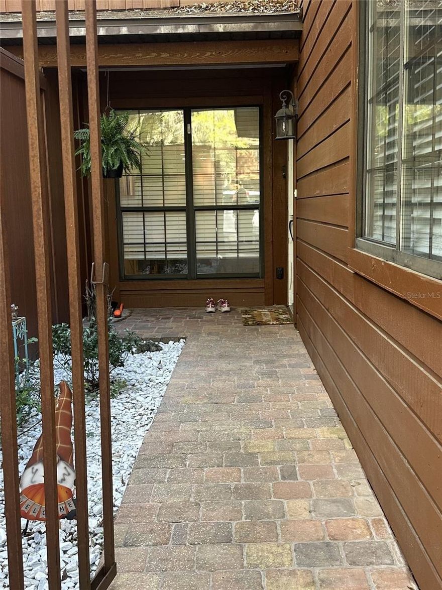 3-bedroom 3 bath unit. The front area courtyard has a stone walkway. A combined living and dining area. Kitchen has butcher block countertops with upgraded tile flooring. Laminate flooring thought the living room, dining room and bedrooms. 1 bedroom and bath downstairs and 2 bedrooms and baths upstairs. Enclosed screened in porch with laundry room. On the bus line to Santa Fe college and to University of Florida, Butler Plaza area, Celebration point, shopping, restaurants near the Oaks mall. Easy access to I 75.  HOA covers maintenance to exterior walls, roofs, pools, tennis courts & common areas.