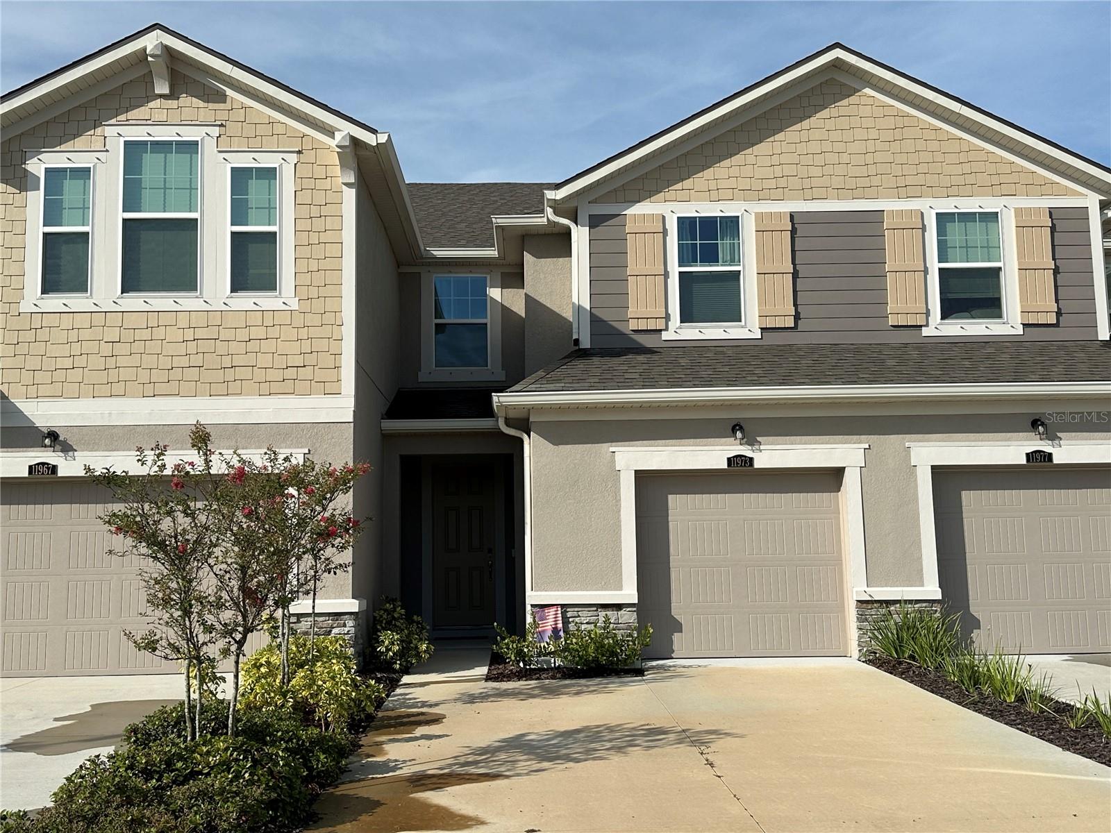 Available 9/1/25. Welcome to your contemporary, spacious townhouse in Harmony of Lakewood Ranch. Complete with ceramic tile plank flooring throughout the main living areas on the first level, this two-story townhouse has 3 bedrooms / 2.5 bathrooms. The modern kitchen has gorgeous quartz countertops, a huge island with a sink and two gold-toned downlighting, 42-inch upper cabinets. In the spacious living area, unwind with your loved ones on the Lazy Boy couches. When you walk into the lanai, enjoy the beauty of the nature and the beautiful water view. Go upstairs to the living quarters and discover the roomy master suite with an exquisite master bathroom including double vanity sinks and quartz countertops. Additionally, there is a laundry room with upscale washers on this floor, and the other two roomy bedrooms are situated opposite the shared bathroom. Additional amenities of the house include all the necessary cooking supplies, pots, pans, and silverware, as well as accordion-style shades on all the windows and fans throughout. This Harmony at Lakewood Ranch complex features walking trails through a conservation area surrounding the community, a state-of-the-art fitness center, a clubhouse, an events lawn, and a pool. In a short distance are the UTC shopping district, Lakewood Ranch Main Street, LECOM Dental School, and the energetic city of Sarasota. Come see this townhome! You will be excited from the time you open the front door!