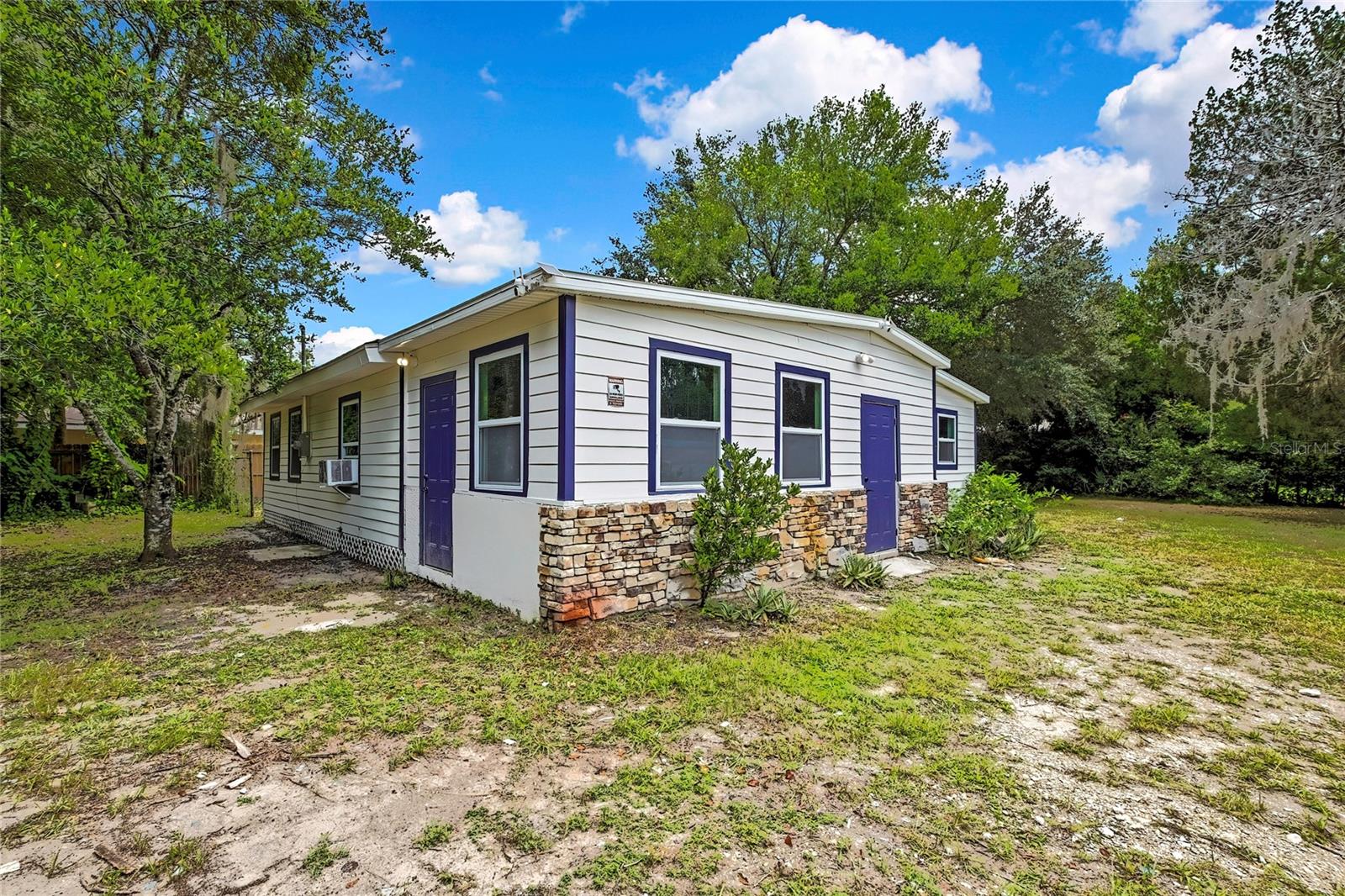Welcome to this beautifully reimagined 3-bedroom, 2-bathroom home located in the heart of Crystal River. Set on a generously sized lot with mature trees, this home offers the perfect blend of modern upgrades and comfortable living. A brand-new roof was installed in 2023, and the septic system was completely replaced, including the tank and drain field. The Florida room was rebuilt from the ground up with a concrete foundation, new framing, and ceiling. The main structure underwent significant improvements including the removal of old flooring and subfloor, repairs to the pier and beam foundation, installation of new wood framing, and new concrete and hydraulic risers. A brand-new subfloor and luxury vinyl plank flooring now extend throughout the home. All exterior walls have new plywood sheathing and freshly painted wood siding. The entire plumbing system was replaced with all new water and drain lines. The electrical system was completely rewired with new switches and outlets installed. A new meter base and breaker panel were installed, and exterior lights were added at every entrance for added safety and charm. Both bathrooms boats stylish finishes and fixtures. Two brand-new air conditioning units were added for efficient, zoned climate control. The property also features a powered shed with updated electrical service for the well, and a brand-new well pump. Significant landscaping was completed, including the removal and trimming of multiple trees, giving the outdoor space a fresh and inviting feel. This home is truly move-in ready and feels like new, both inside and out. With access to the Gulf of America, freshwater springs, and the Crystal River itself, it’s a haven for boating, fishing, scalloping, and diving. Crystal River is known as the “Home of the Manatee.” The crystal-clear springs attract hundreds of manatees each winter, and residents can kayak, paddleboard, or even swim alongside these gentle giants in protected waters. The area is surrounded by preserves, forests, and wildlife refuges—perfect for those who love hiking, birdwatching, and nature photography. While Crystal River offers a quieter pace, it’s still within driving distance to Tampa, Ocala, and Gainesville, making weekend getaways, healthcare access, and shopping easy. Don’t miss the opportunity to own a gorgeous property in one of Florida’s most beautiful and nature-rich communities—schedule your showing today!