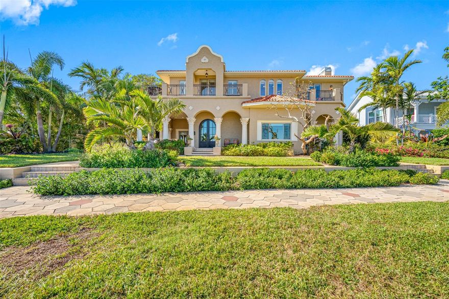 Timeless Elegance Meets Modern Luxury in Old Southeast St. Pete.  Step into sophisticated waterfront living in this meticulously remodeled Great Gatsby-era estate in Old Southeast, St. Petersburg. Overlooking historic Lassing Park and Tampa Bay, this 5,762 SF residence sits on a 100’x156’ double lot in preferred Flood Zone X. With 5 bedrooms, 5 full baths, boasting a complete remodel, this home blends classic charm and modern convenience, including a brand-new 2024 tile roof. The grand front veranda offers breathtaking sunrise views over the bay, while soaring ceilings and expansive walls create a stunning space for art lovers. Travertine tile floors flow through the main level, where a chef’s kitchen boasts quartz countertops, a Viking gas range, Bosch paneled refrigerator, Thermador appliances and a porcelain farm sink. The spacious dining area and bonus room capture stunning waterfront views, while the family room features a stone gas fireplace and access to an outdoor dining area with bay views. A main-floor office ensuite includes a full bath, generous storage, and a wrap around veranda with water views. A sweeping staircase and private elevator lead to the second level, where the spectacular primary suite features a sitting area, wraparound balcony with full water views, and a spa-inspired bath with a garden tub, walk-in shower, custom vanities, and an expansive walk-in closet with integrated laundry. Three additional bedrooms offer custom closets, private balconies, and breathtaking water views, ideal for family or guests. The private backyard oasis showcases a heated saltwater pool with a sun shelf, lush landscaping with mango, banana, and starfruit tree, easy care turf, and a cedar pavilion for alfresco dining. The detached garage includes an air-conditioned fitness room with an ensuite bath, while the renovated 700 SF guest apartment features a studio bedroom, full kitchen, bonus room, walk-in closet, and a private full bath. This gated estate includes a private 3 car drive, 1 car garage with EV charger, and a prime location just minutes from vibrant downtown St. Pete and Harborage Marina. Old Southeast St. Pete is renowned for its many private art studios and iconic colored hexagon block sidewalks. Enjoy Lassing Park’s 15 acres of protected green space, kite surfing, fishing and kayaking just steps from your front door. Don’t miss this rare opportunity to own this magical waterfront masterpiece in one of St. Pete’s most iconic neighborhoods. Home is high with no water issues from recent storms.  Elevation Certificate Flood Zone X. A unique blend of incredible water views without the worry of flood. House sold unfurnished. Yard art sculptures do not convey. Floorplan photos slides 99 & 100 Enjoy the Video:  https://vimeo.com/1035835259?share=copy